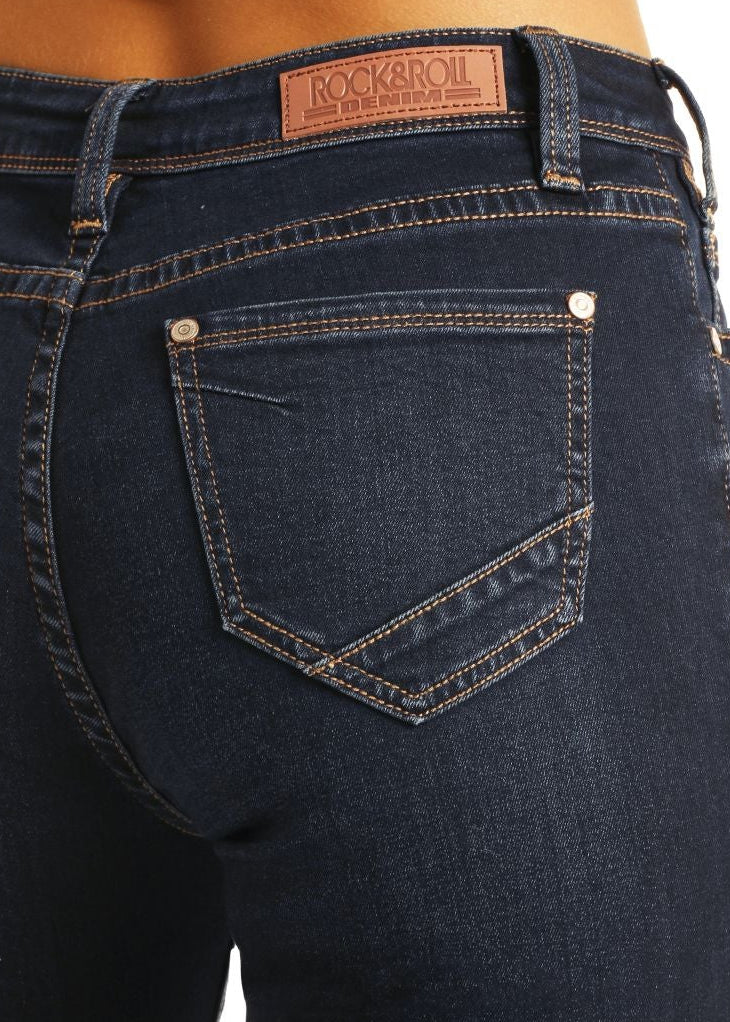 Dark blue jeans with a brand label on a white background
