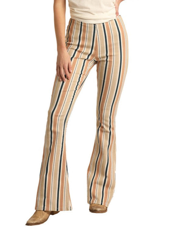 A person wears Rock & Roll Denim Striped High Rise Flare Leg Jeans with a white top and brown shoes. Only the lower half is visible against a white background.