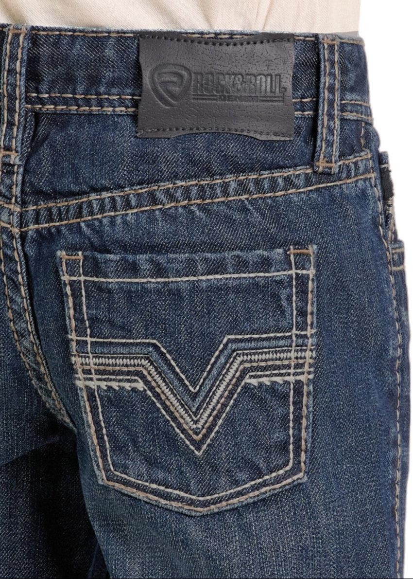 Close-up of the back pocket and waistband of Boys' Regular Fit Dark Signature Pocket Bootcut Jeans from Rock & Roll Denim, showing white stitching and a black leather Rock & Roll Denim logo patch above the pocket.
