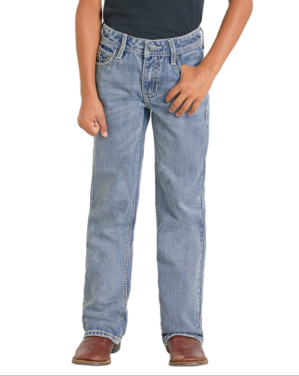 A child models the Rock & Roll Denim Boys' Regular Fit Raised Signature Bootcut Jeans, wearing a black shirt and brown boots, standing against a white background with one hand in a pocket.