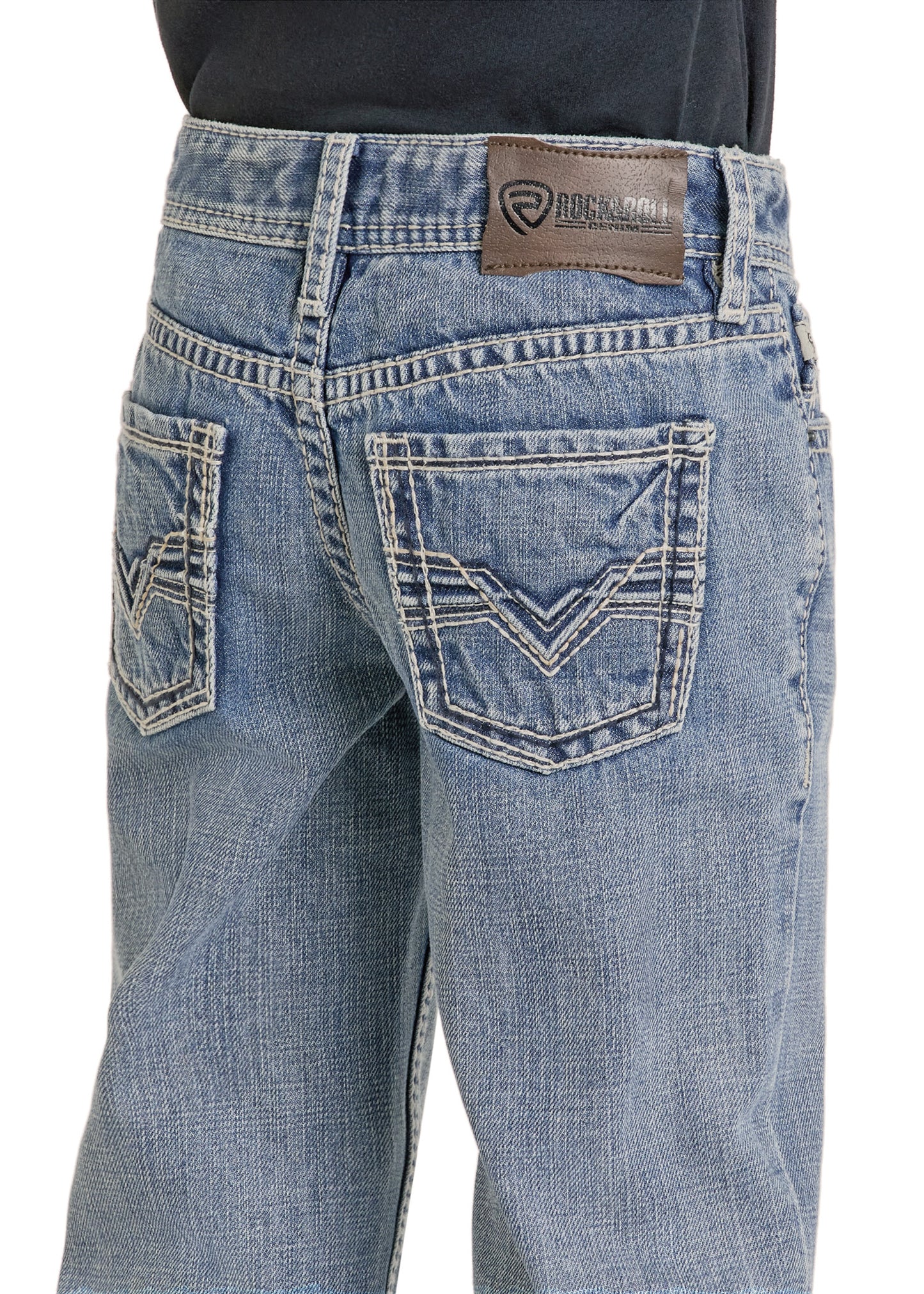 A close-up of the back of a person wearing Rock & Roll Denim Boys' Regular Fit Raised Signature Bootcut Jeans in light blue, featuring decorative stitching on the back pockets and a brown leather brand patch on the waistband.