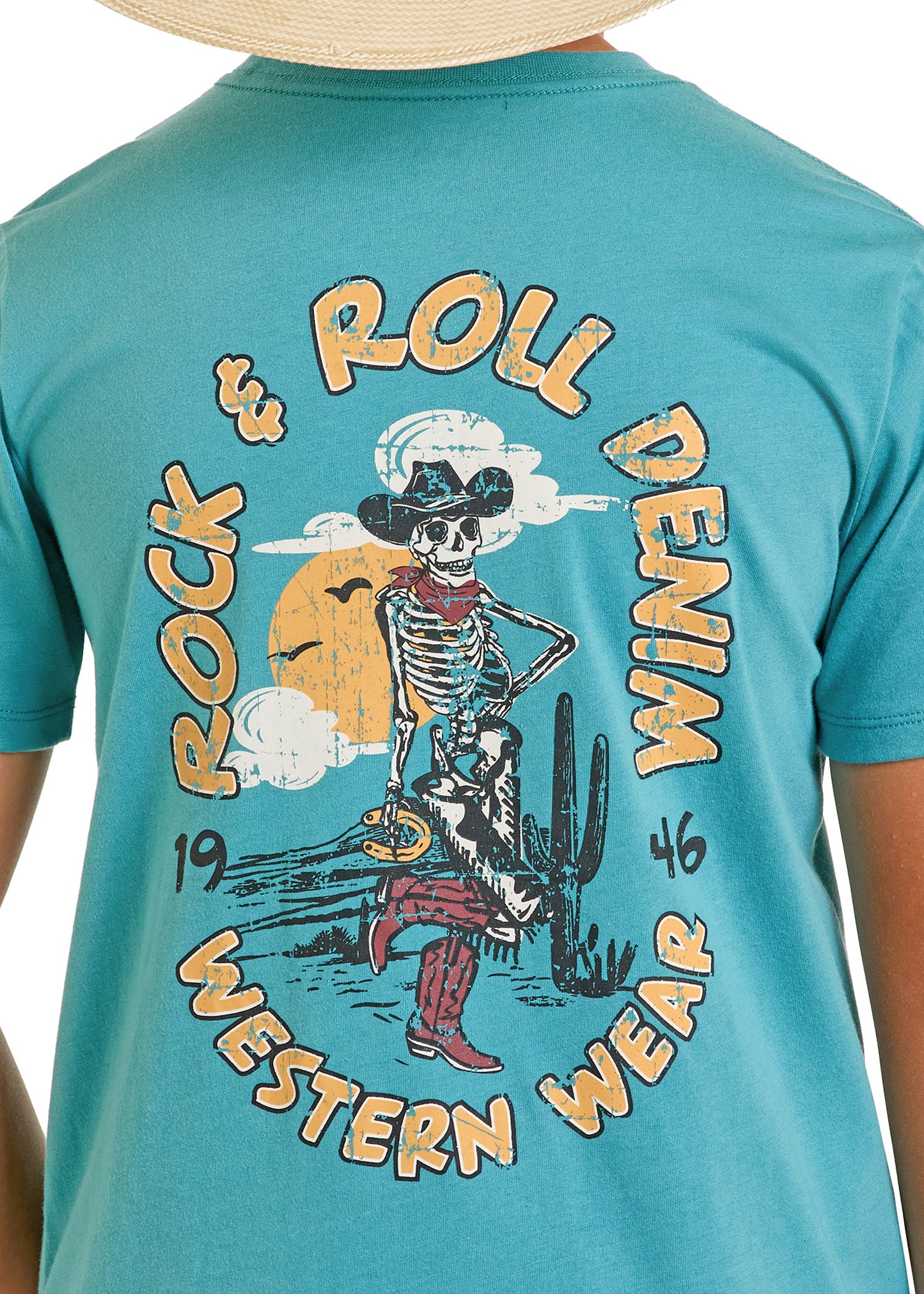 The Boys' Turquoise Skeleton Tee by Rock & Roll Denim features a graphic of a skeleton cowboy with a lasso in a desert scene, adding adventurous spirit to any outfit.