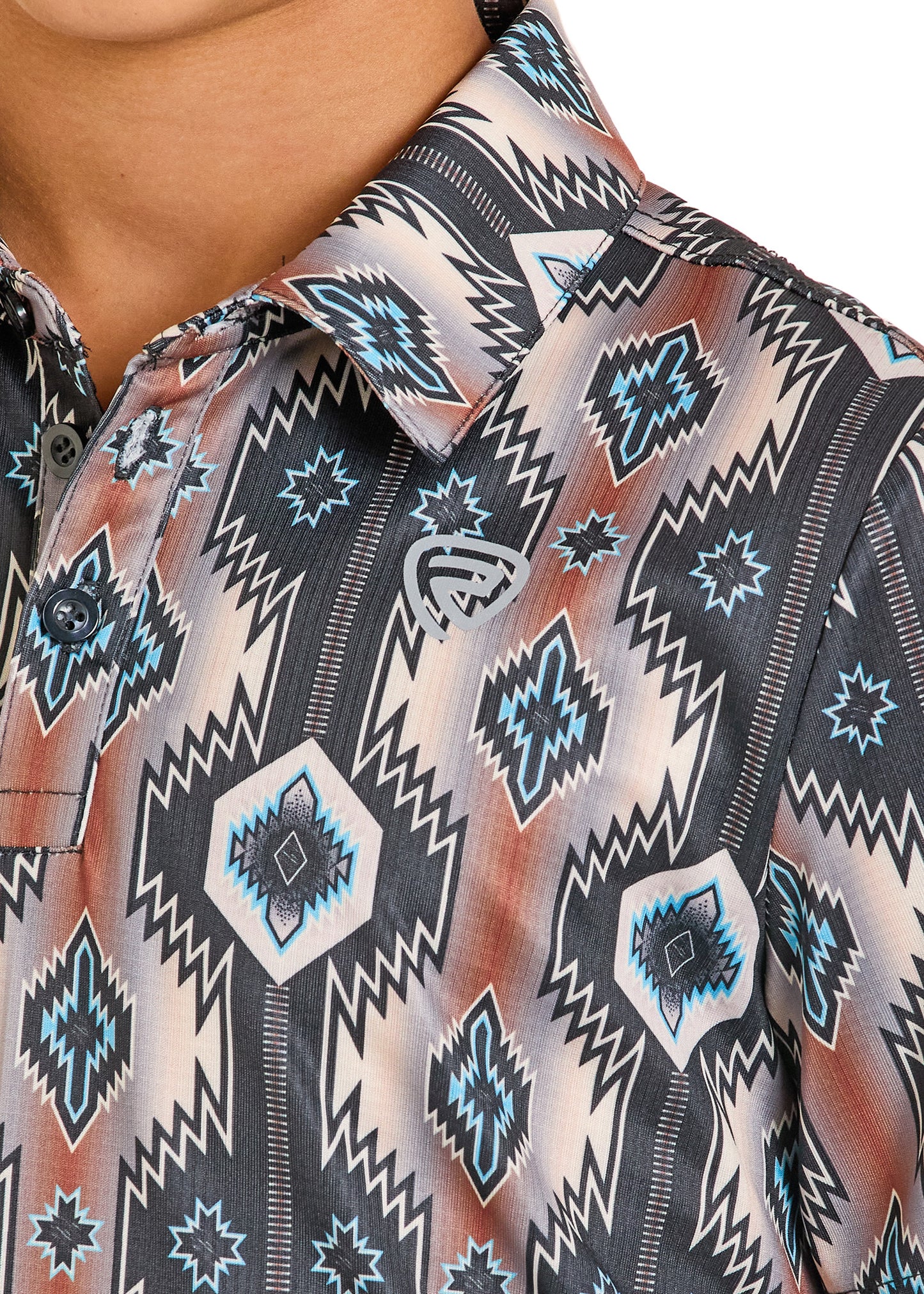 Close-up of a patterned shirt with geometric designs.