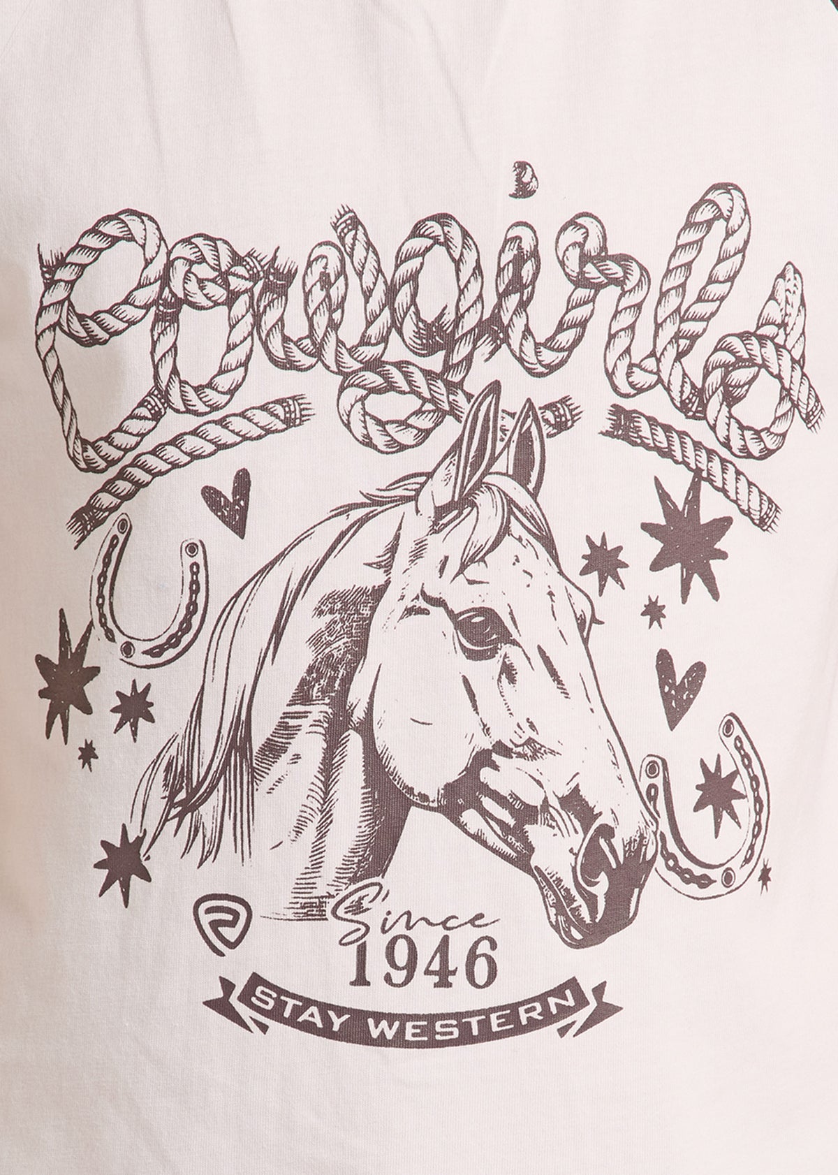 A close-up of a light-colored fabric featuring a detailed brown graphic print of a horse head surrounded by rope, stars, hearts, horseshoes, and the text 'Cowgirl Since 1946 Stay Western'.
