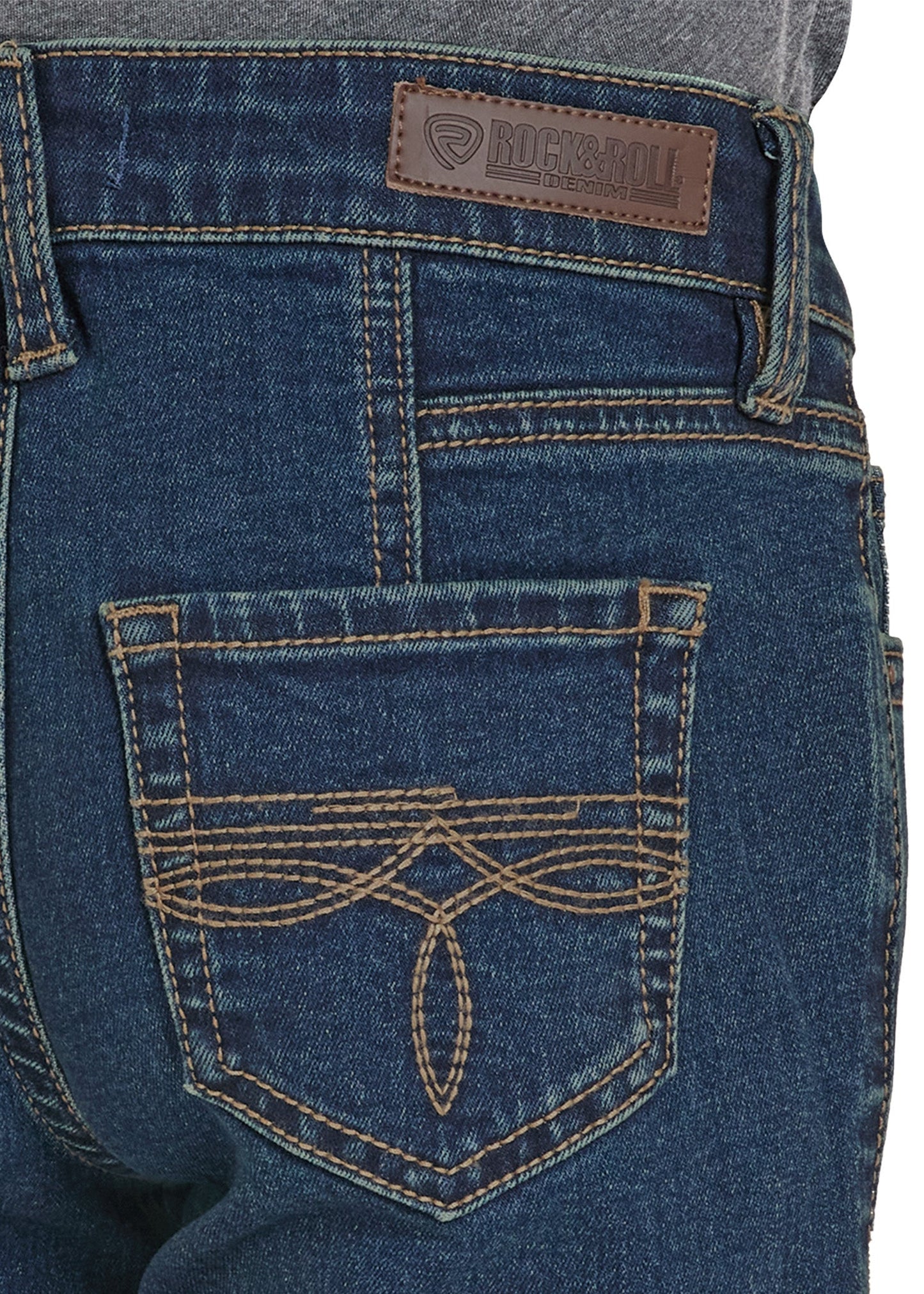 Close-up of blue jeans with a brand label on the pocket.