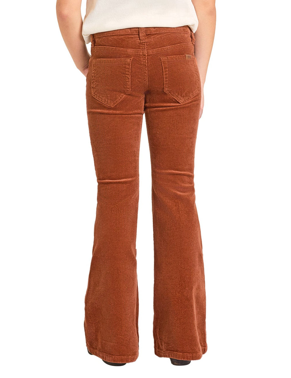A girl is seen from the back wearing Rock & Roll Denim Girls' Rust Corduroy Flare Jeans with two back pockets, a fitted high waist, and classic cowgirl style, standing against a white background.