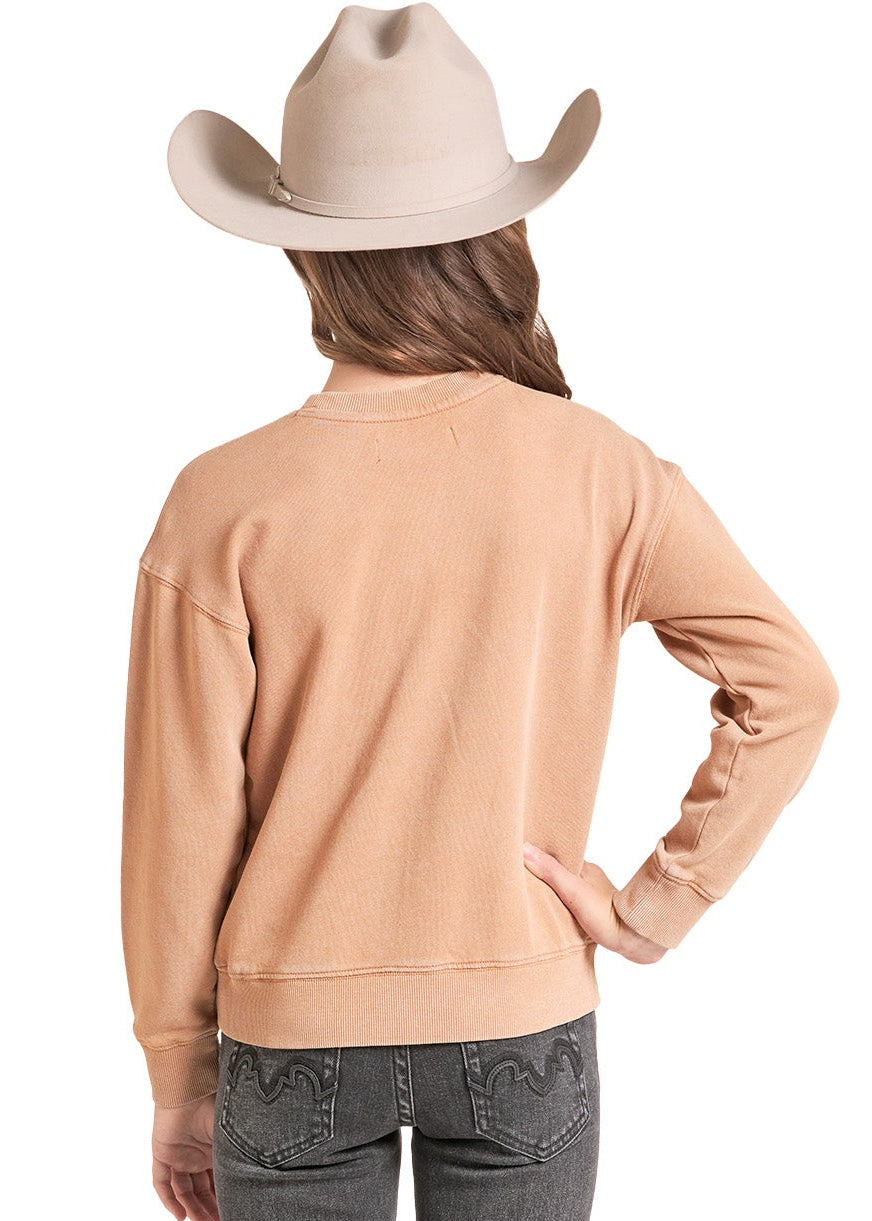 A child model shown from the back wearing a light peach long-sleeve top, dark gray flared jeans, and a beige cowboy hat against a plain white background.