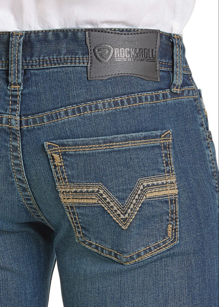 Close-up of the back of Rock & Roll Denim Regular Fit Classic Embroidery Bootcut Jeans in blue with contrast stitching and a gray leather patch on the waistband, paired with a white tucked-in shirt.