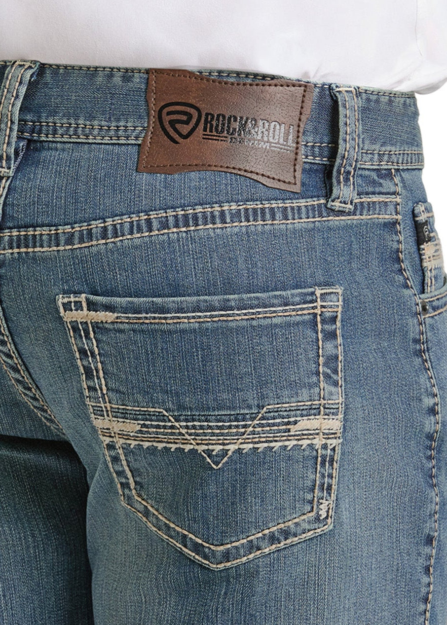 Blue jeans with a visible brand logo on the back pocket against a white background