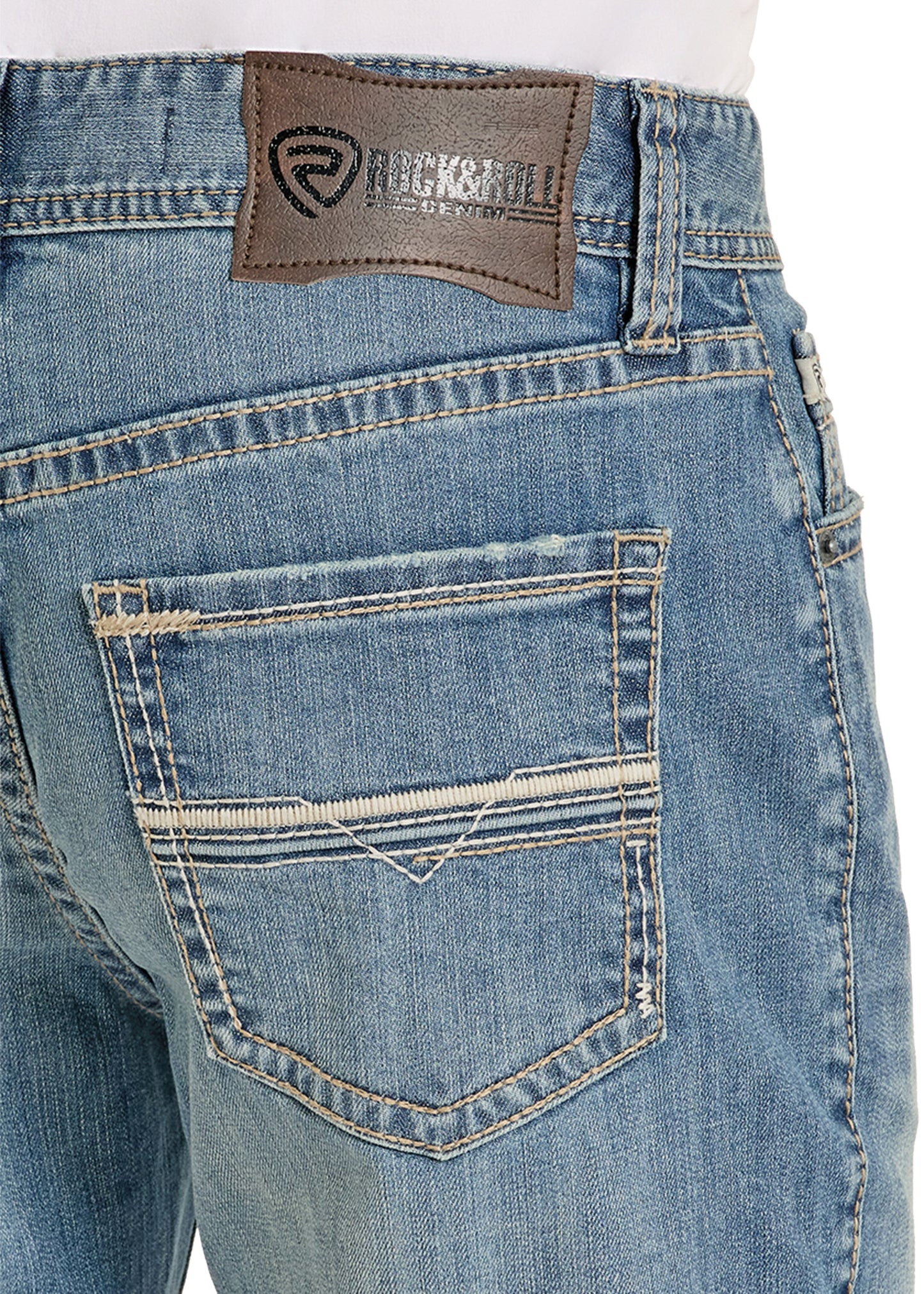 Close-up of blue jeans with a brand label on the back pocket.