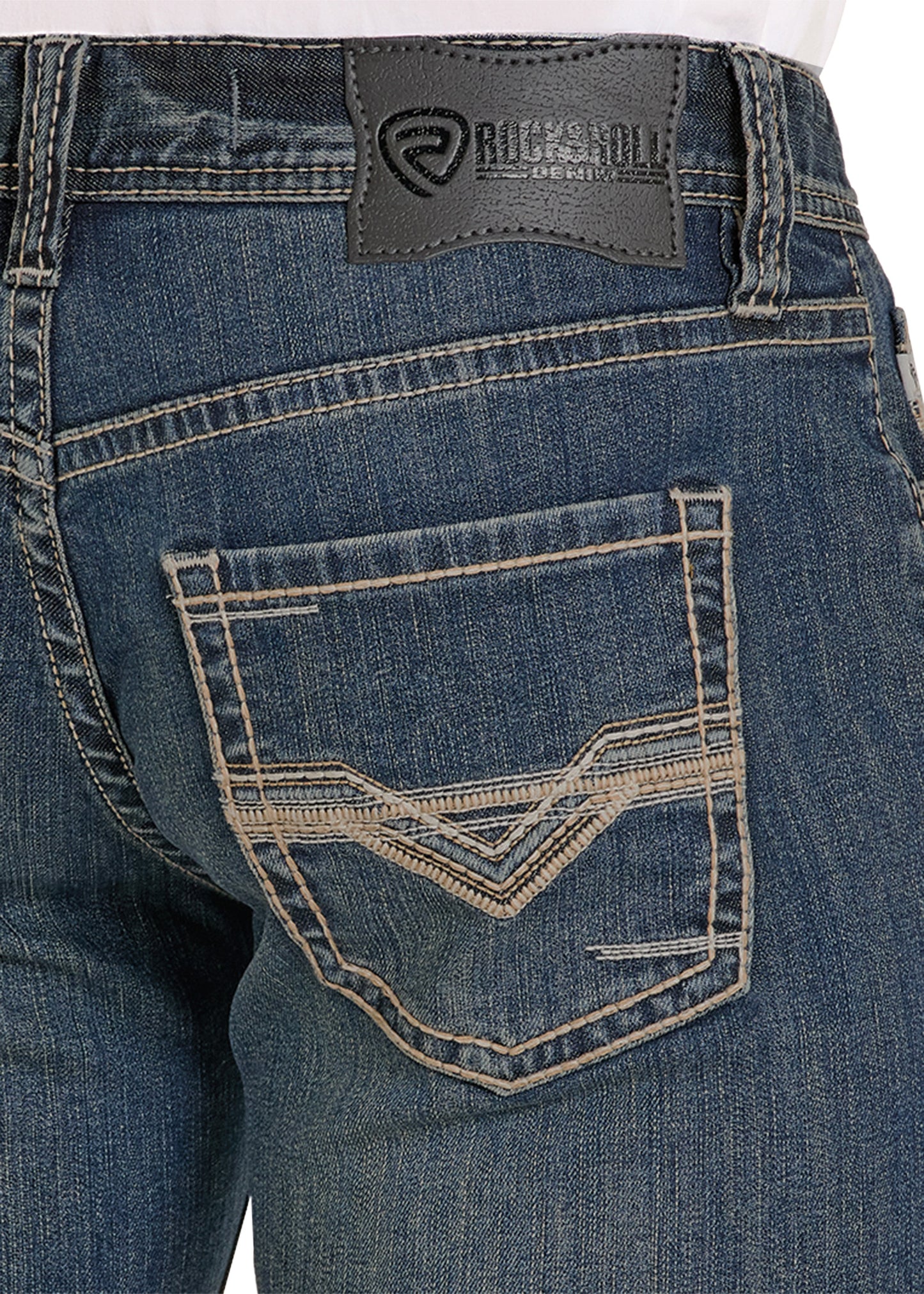 Close-up of blue jeans with a brand label on the pocket area.