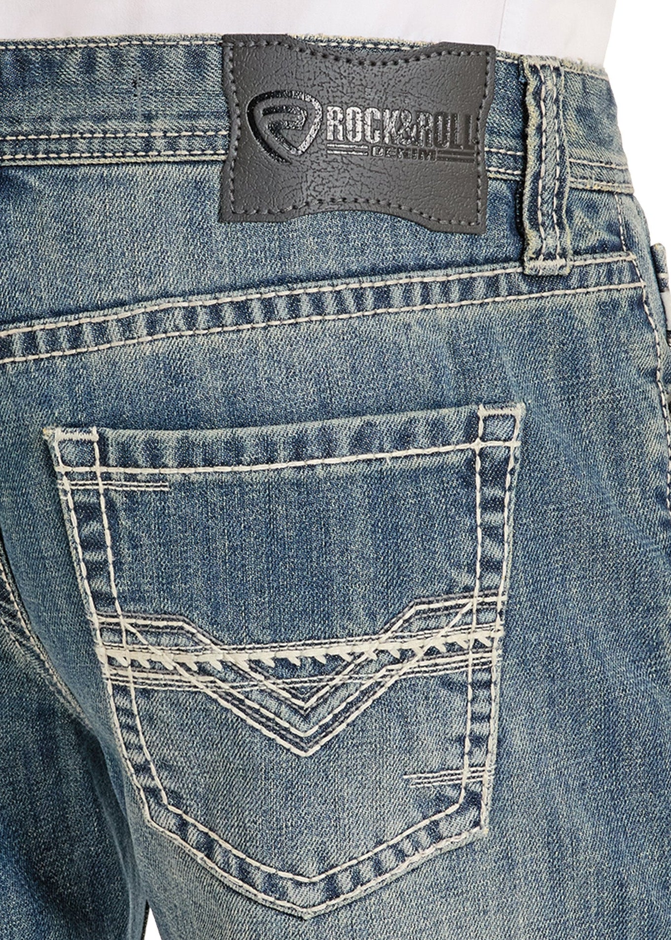Close-up of blue jeans with a brand label on the back pocket.