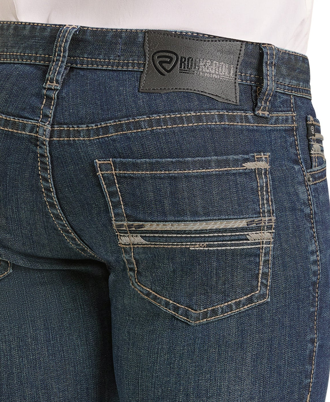 Close-up of the back of blue Slim Fit Pleather Pocket Stitch Straight Leg Jeans by Rock & Roll Denim, featuring contrast stitching, a pleather-detailed back pocket, and a black leather logo label on the waistband.
