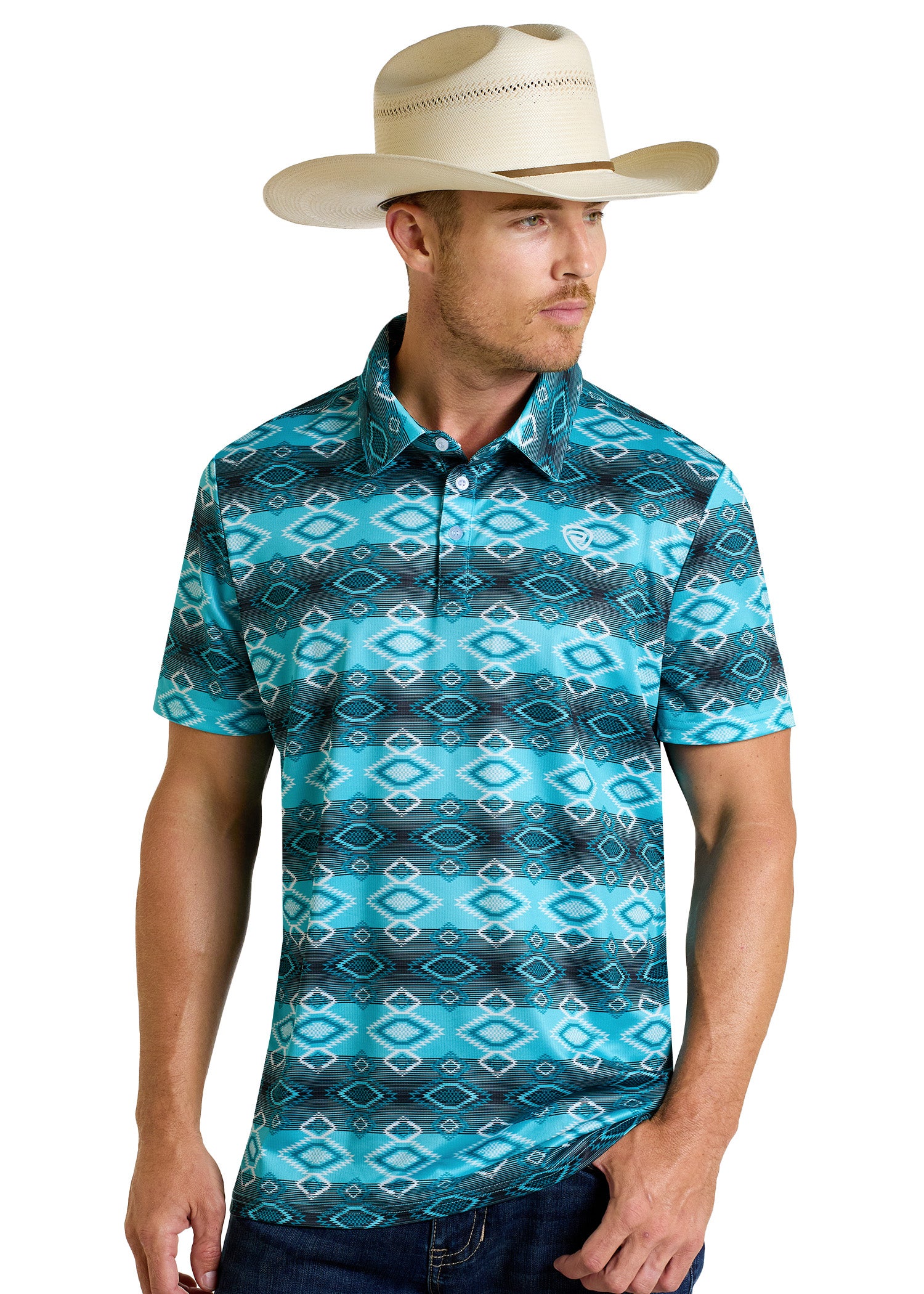 A man in a cream cowboy hat and a Rock & Roll Denim Aztec Vertical Striped Polo stands with one arm relaxed, gazing to the side.