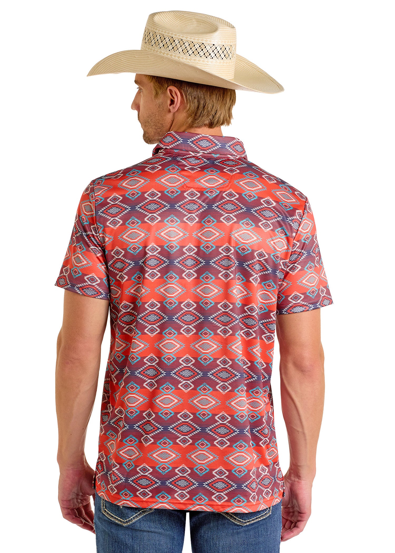 A man in a light-colored cowboy hat and Rock & Roll Denim's Aztec Vertical Striped Red Polo - S stands with his back to the camera, showcasing his casual look paired with classic blue jeans.