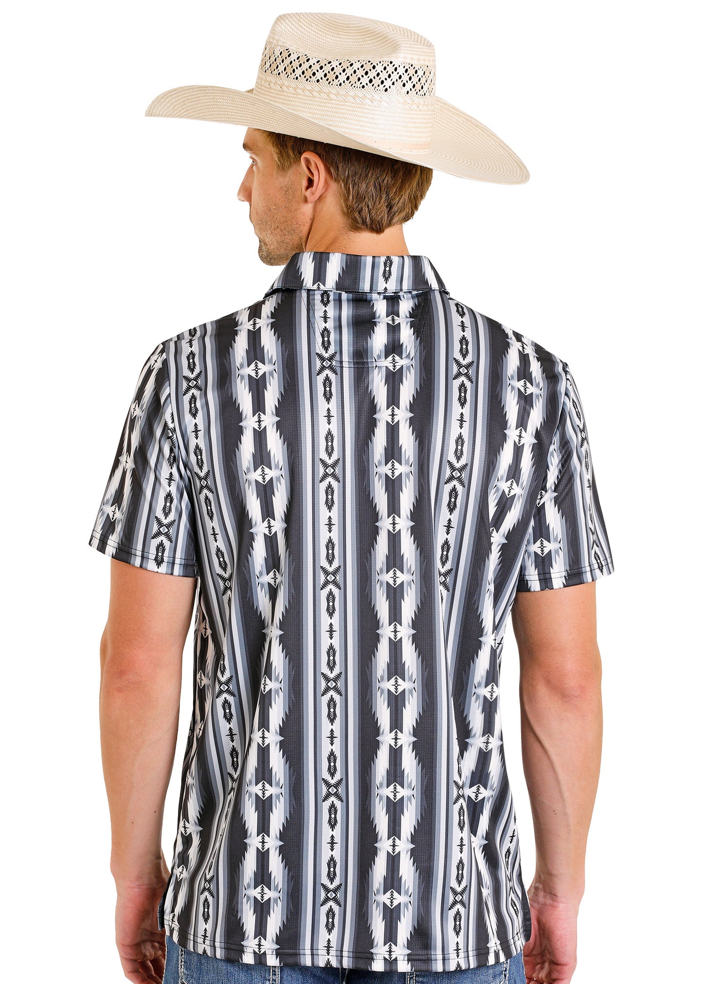 Man wearing a patterned short-sleeve shirt and cowboy hat on a white background