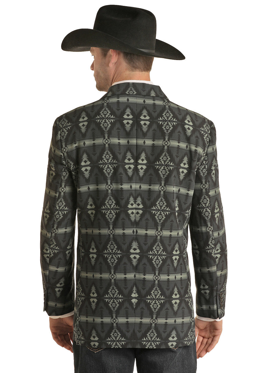 A man wearing a black cowboy hat, blue jeans, and a Rock & Roll Denim Aztec Print Sport Coat is seen from behind, facing slightly to the right.
