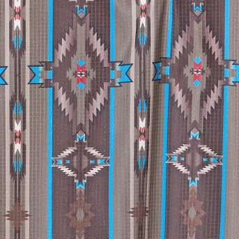 Man wearing a patterned western shirt and cowboy hat on a white background