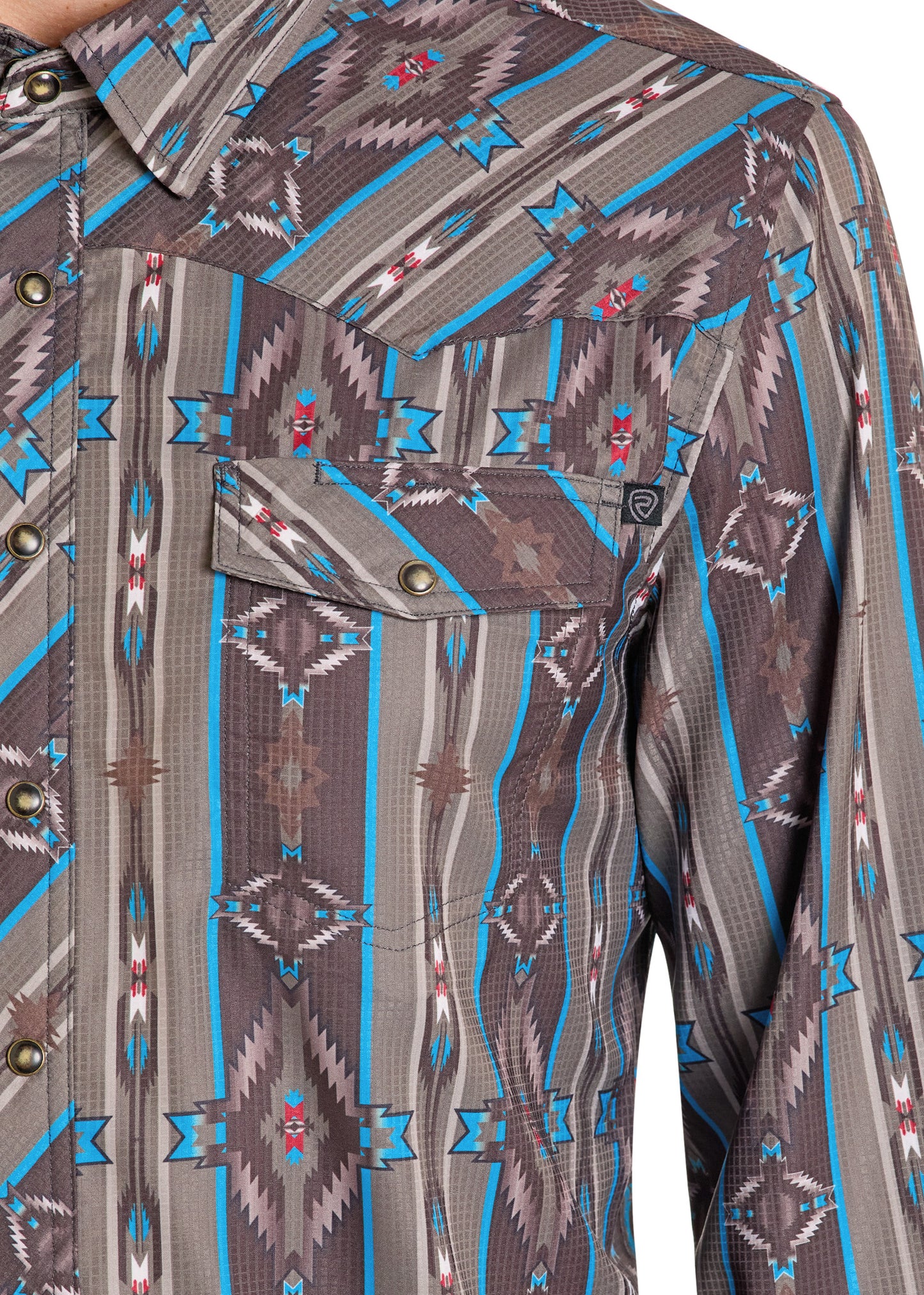 Close-up of a patterned shirt with blue and brown design