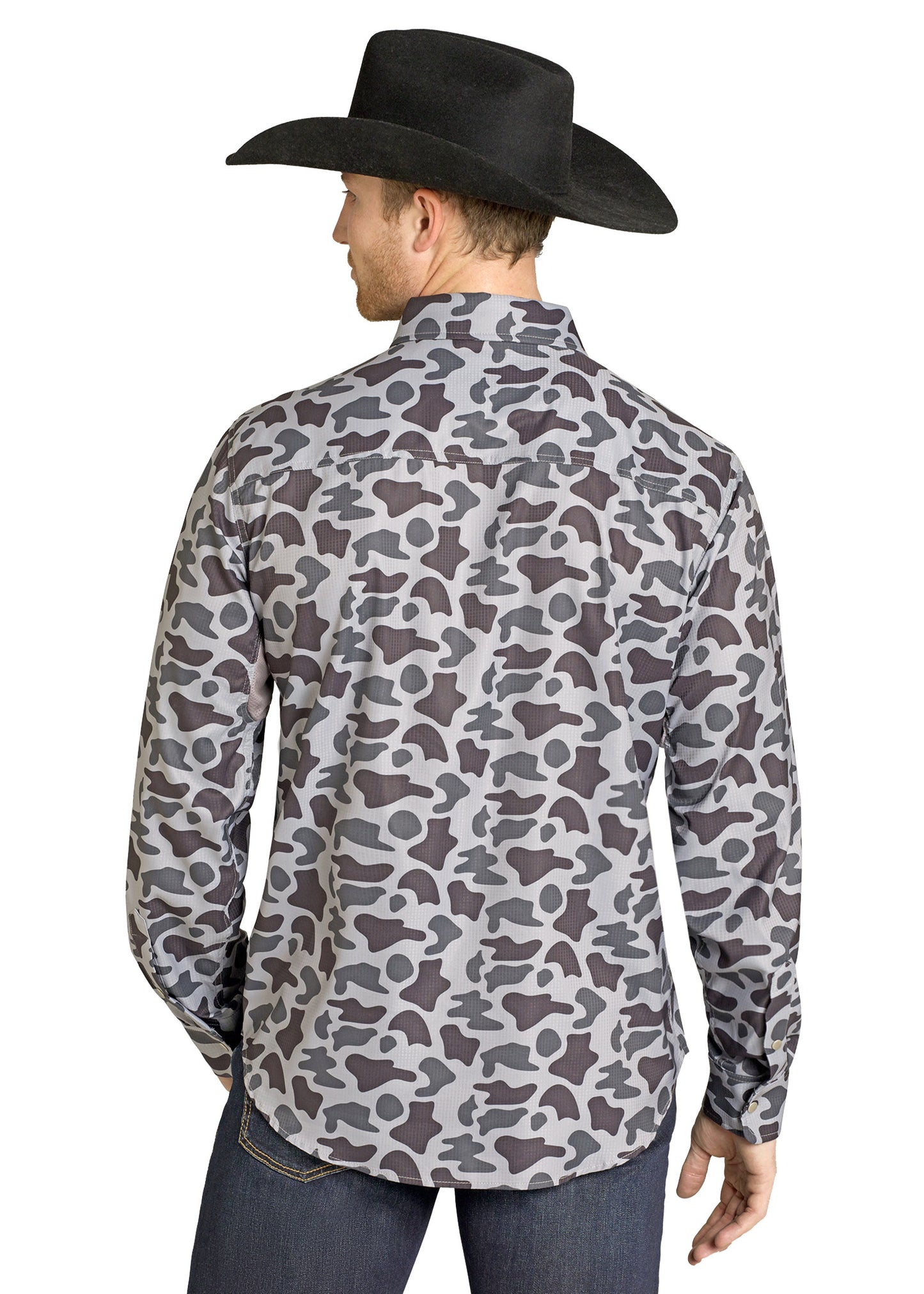 Man wearing a patterned shirt and black cowboy hat on a white background