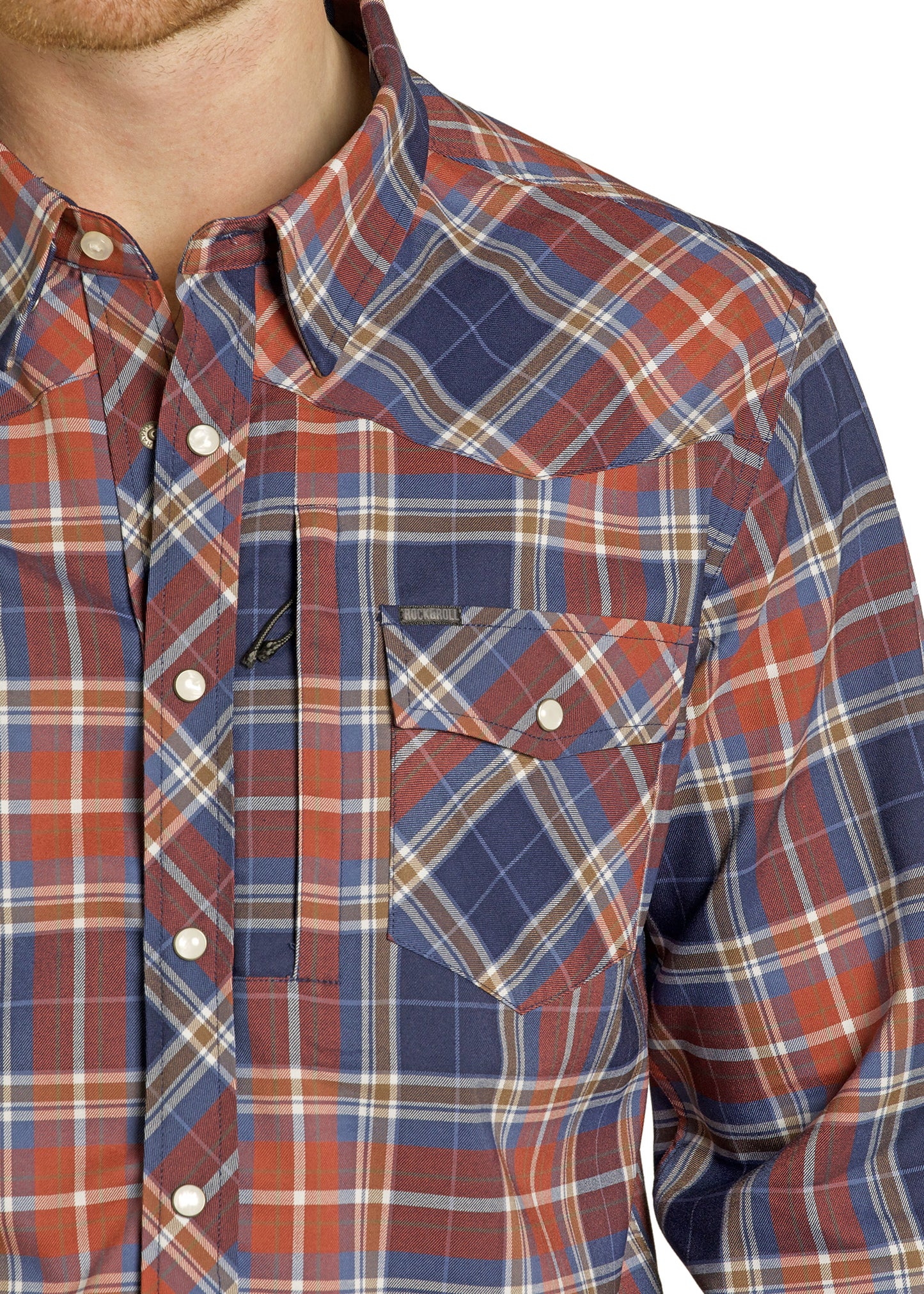 Close-up of a plaid shirt with a focus on the collar and chest pocket.