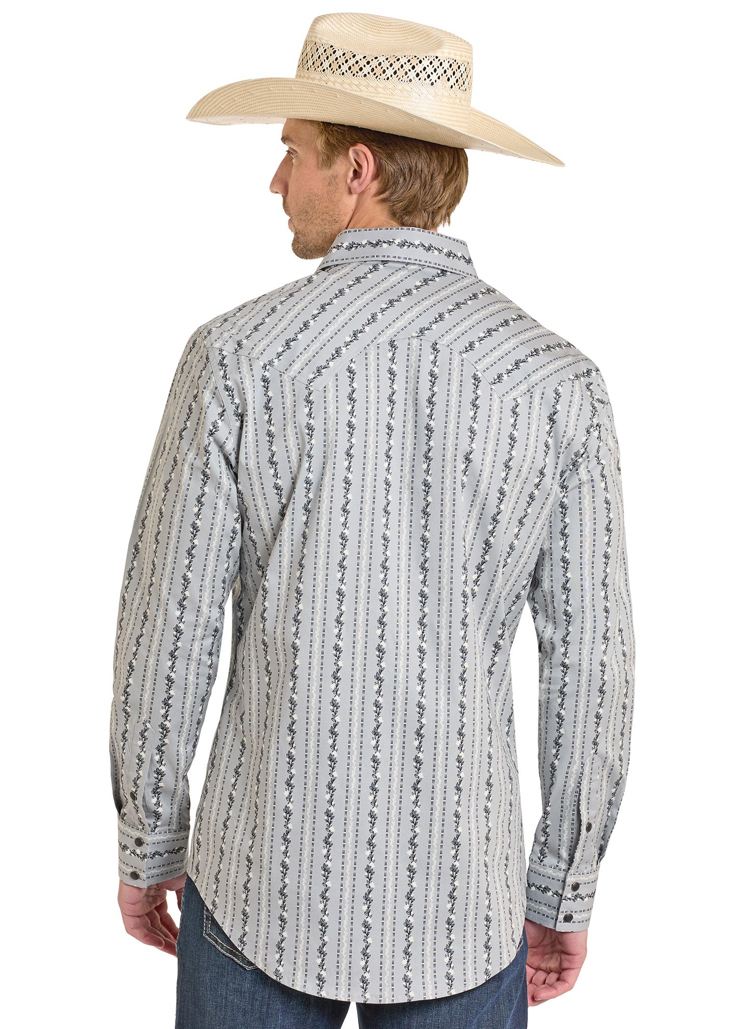 Man wearing a patterned long-sleeve shirt and cowboy hat on a white background