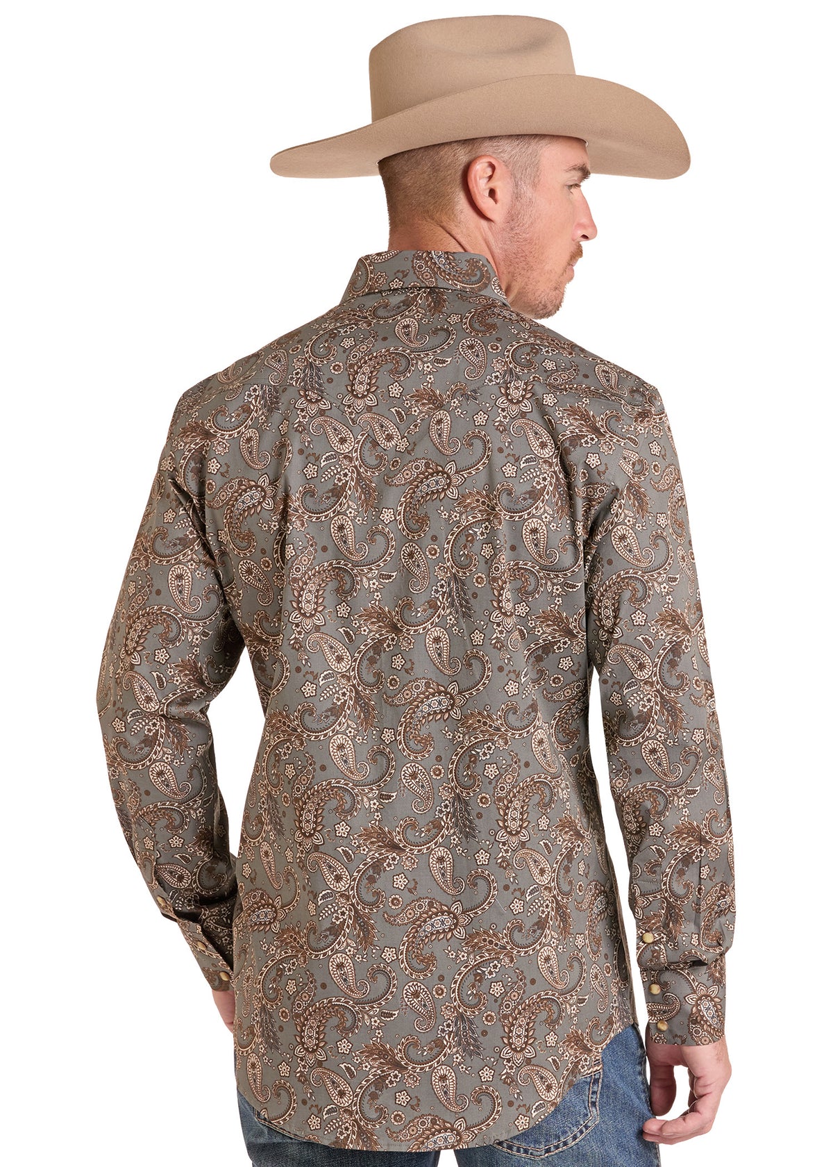 A man shown from the back wearing a long-sleeve western shirt with a brown and beige paisley pattern, paired with a tan cowboy hat and blue jeans, against a plain white background.