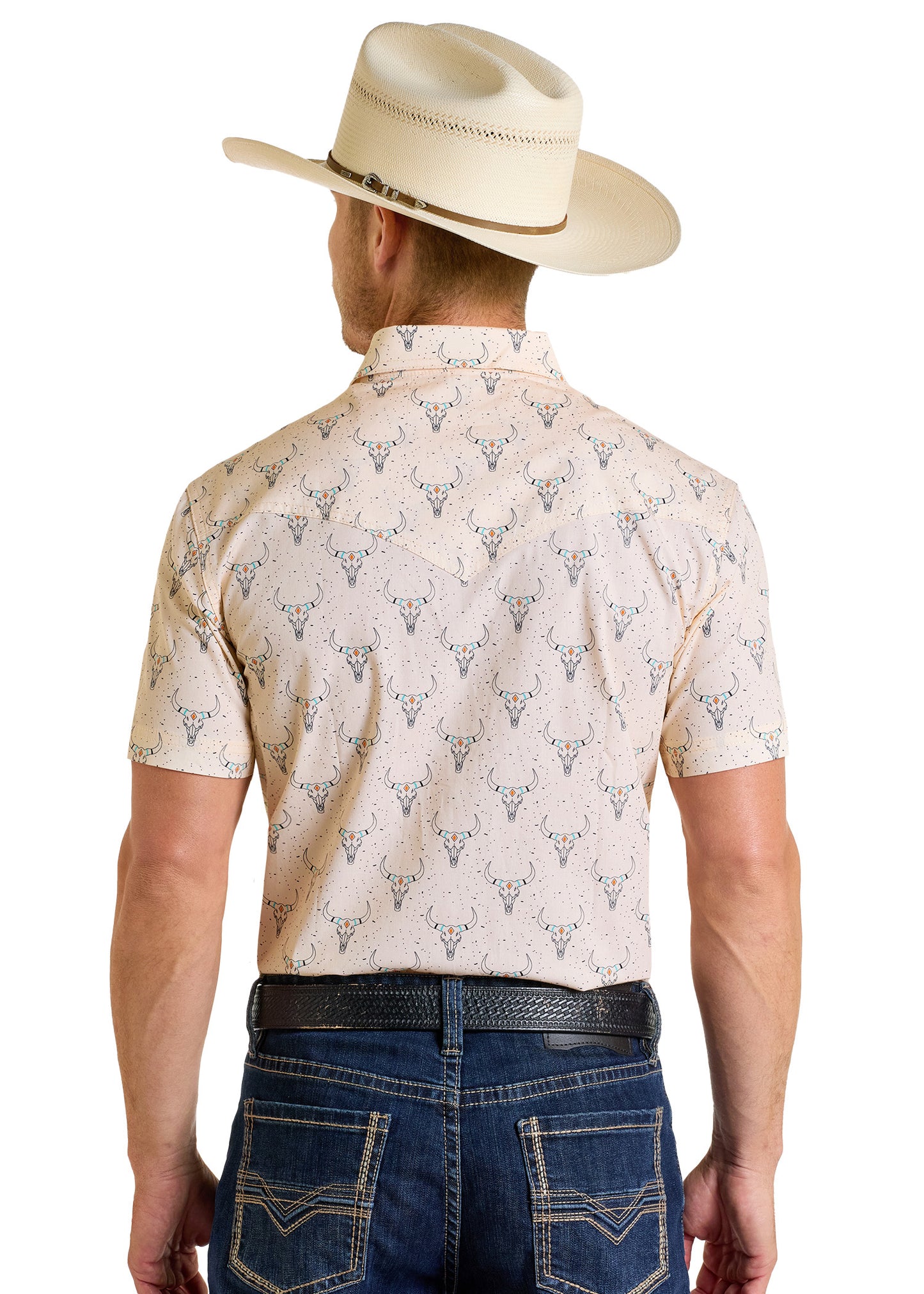 A man is shown from the back wearing a beige cowboy hat, blue jeans with white stitching, a black belt, and the Rock & Roll Denim Dale Brisby Slim Fit Longhorn Print Short Sleeve Snap Shirt.