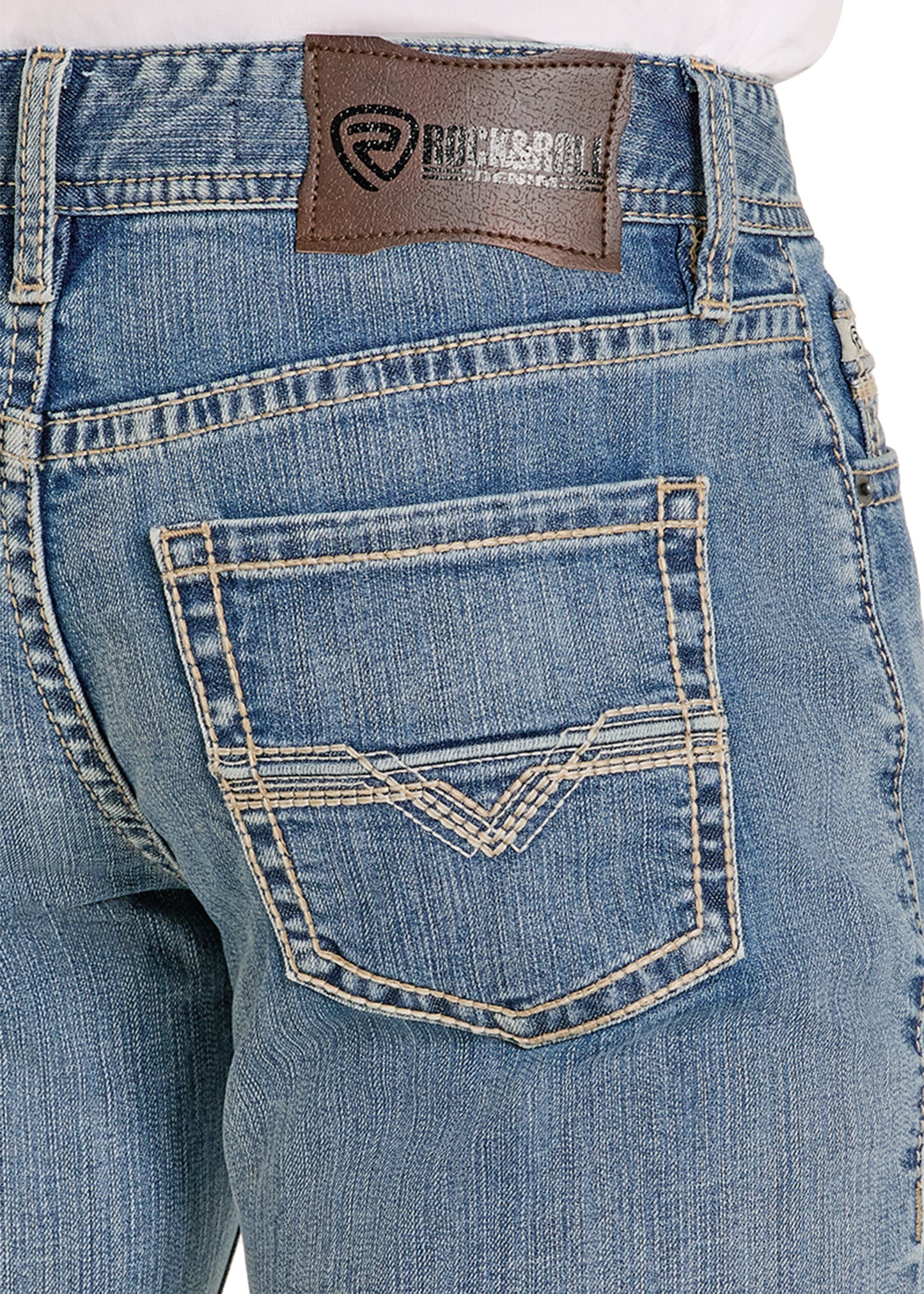 Close-up of blue jeans with a brand label on the pocket.
