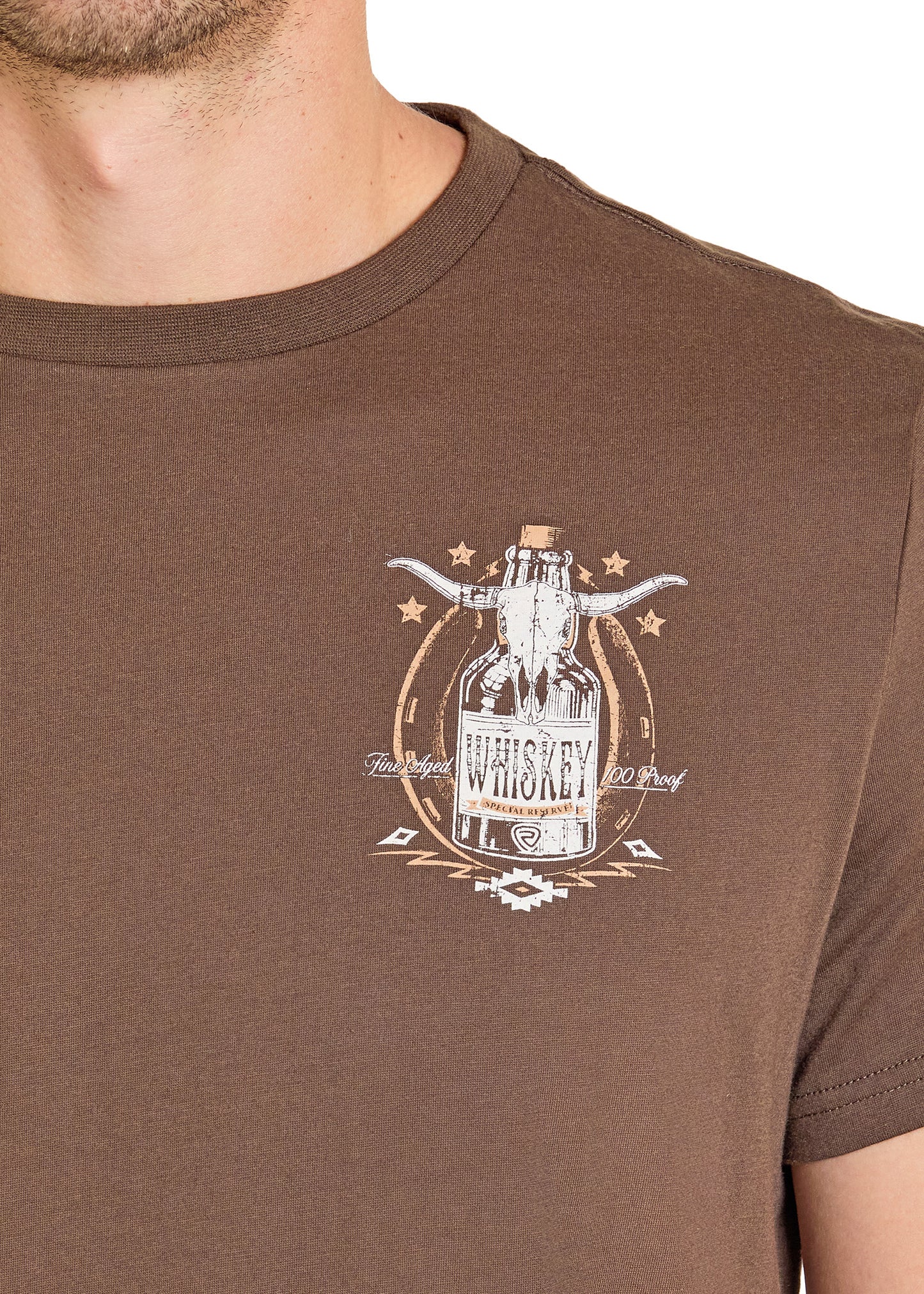 Brown t-shirt with whiskey bottle graphic on a plain background