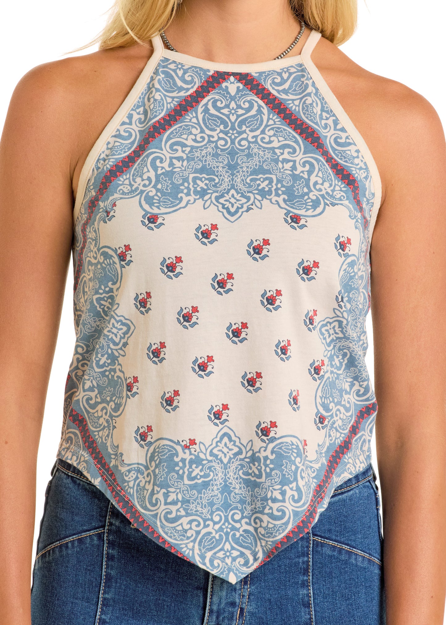 A woman wears the Rock & Roll Denim Scarf Tank Top, a sleeveless halter with blue and red paisley and floral bandana print, paired with blue jeans.