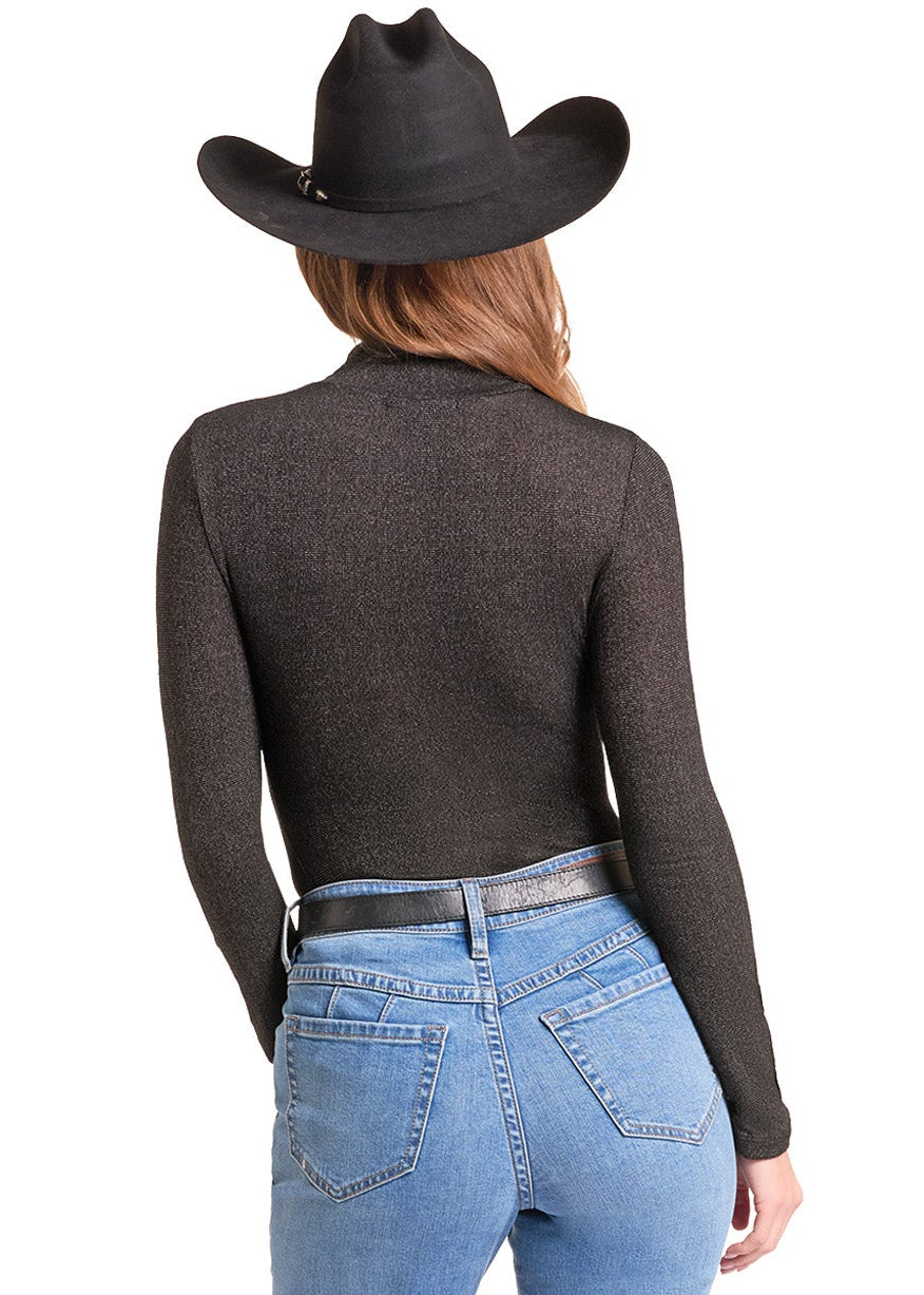 A woman shown from the back wearing a black cowboy hat, a dark brown long-sleeve cropped top, and light blue straight-leg jeans against a plain white background.