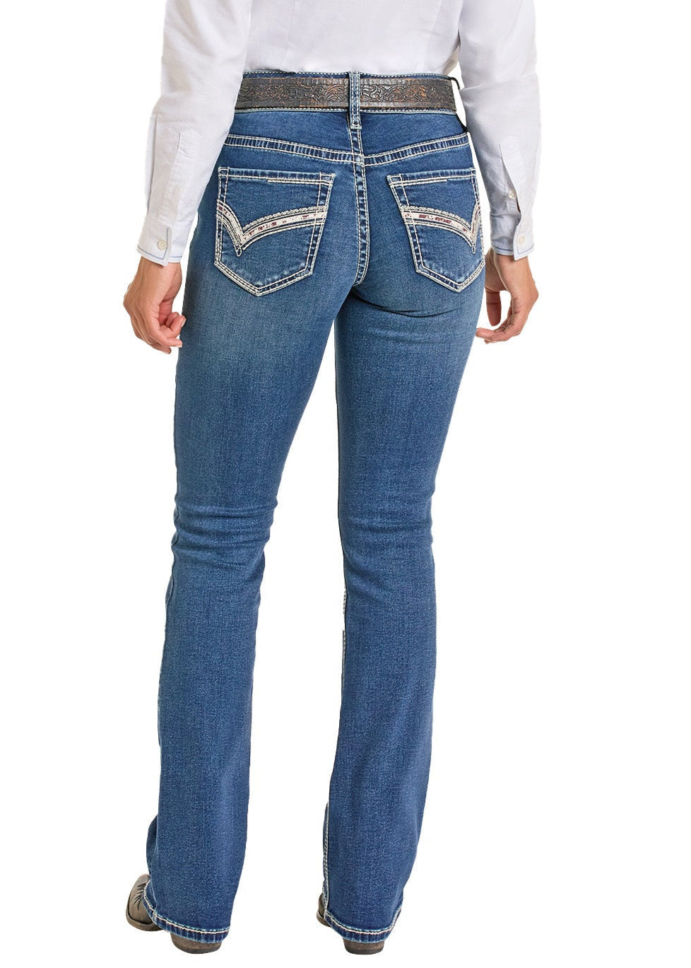 A person wearing Rock & Roll Denim Mid Rise Cowhide Stitch Bootcut Riding Jeans, featuring white-stitched back pockets, and a white long-sleeve shirt, is seen from behind against a white background.