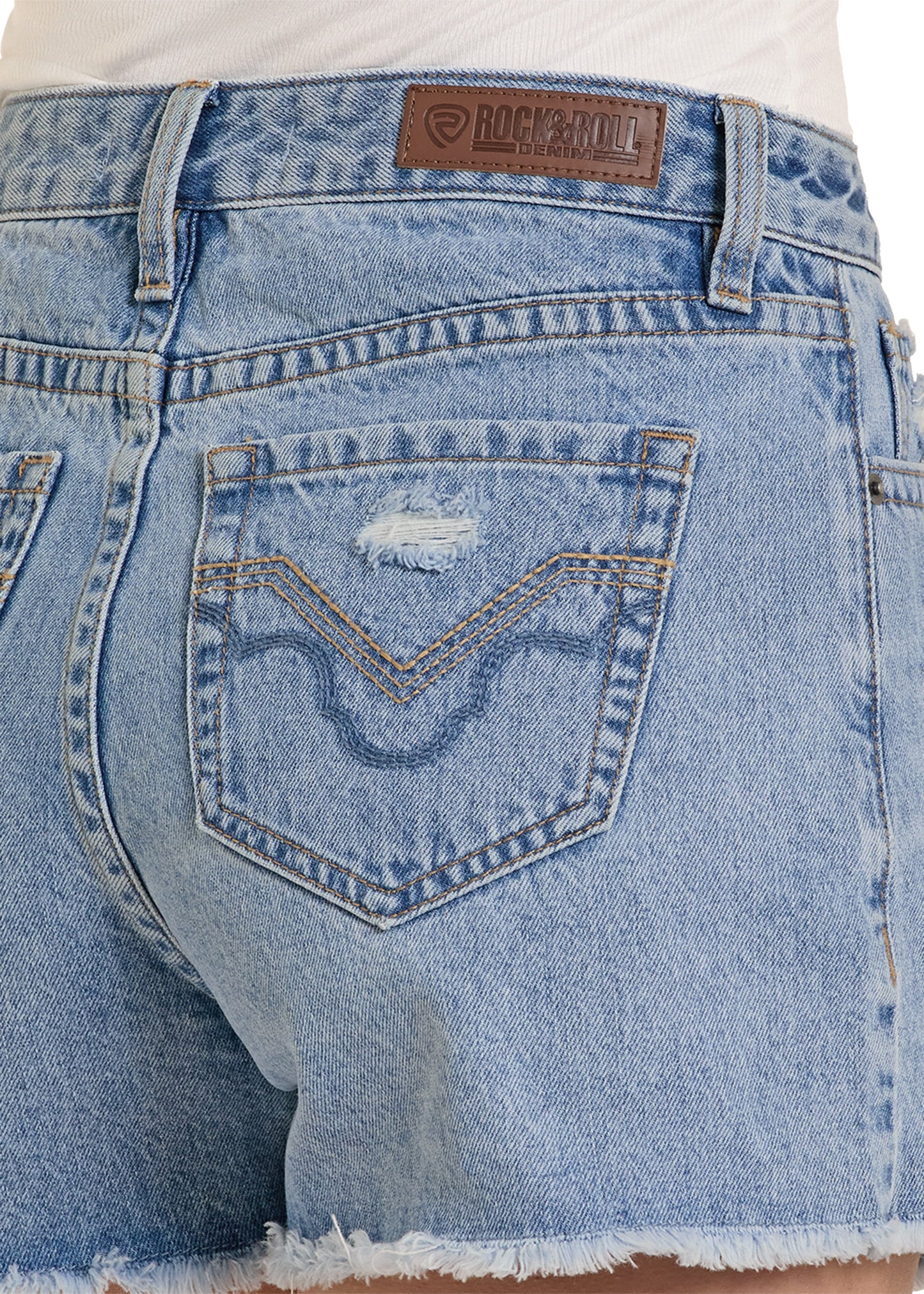 Close-up of a pair of blue jeans with a brand label on the back pocket.