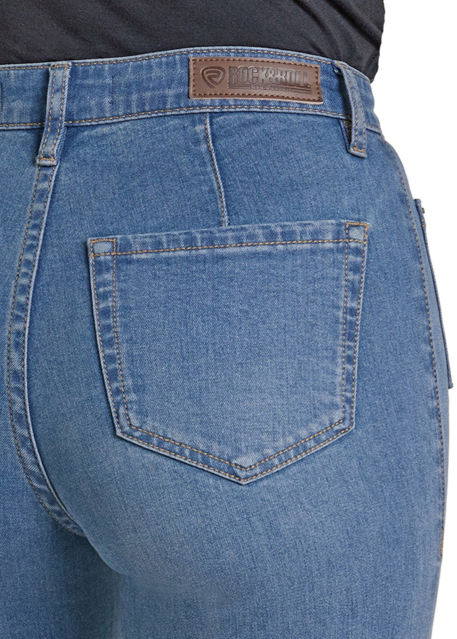 Close-up of the back of a person wearing Rock & Roll Denim Patch Pocket Flare Jeans, showcasing a single back pocket and a brown leather patch with branding on the waistband.