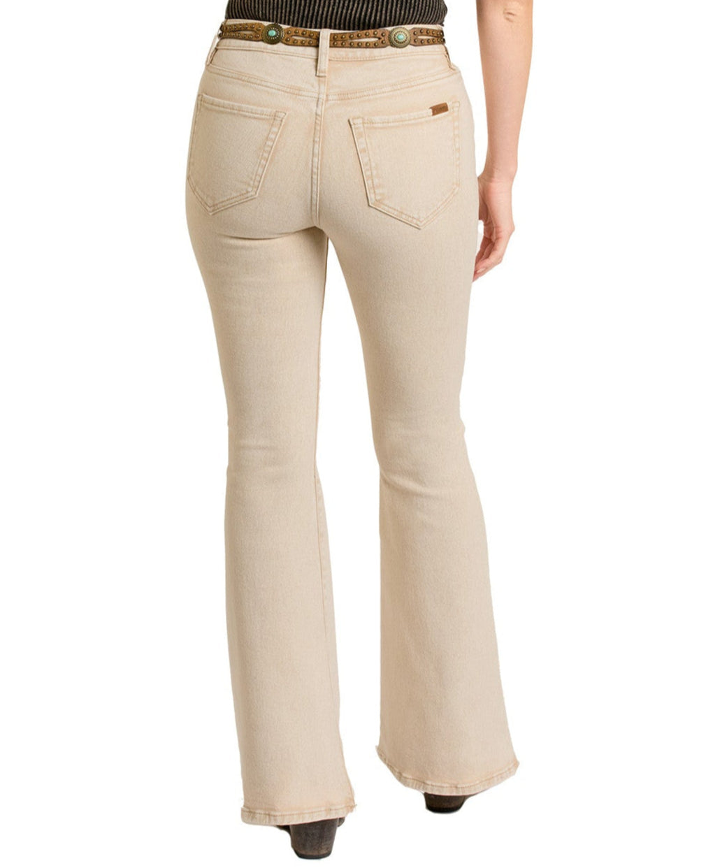 A person is shown from the back, wearing Rock & Roll Denim's Tan Button Flare Jeans and a brown belt, standing against a plain white background.