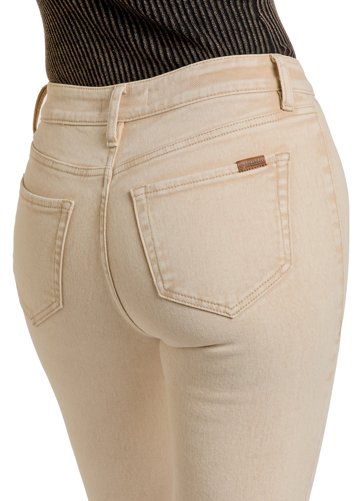A person wearing Rock & Roll Denim’s Tan Button Flare Jeans and a ribbed black top, shown from the waist down and back. The jeans have visible pockets, detailed stitching, and a sleek, modern flair.