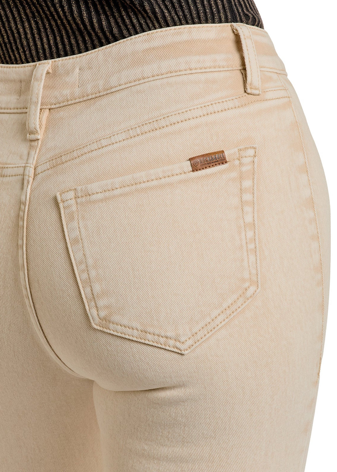 A person wearing Rock & Roll Denim’s Tan Button Flare Jeans and a ribbed black top, shown from the waist down and back. The jeans have visible pockets, detailed stitching, and a sleek, modern flair.