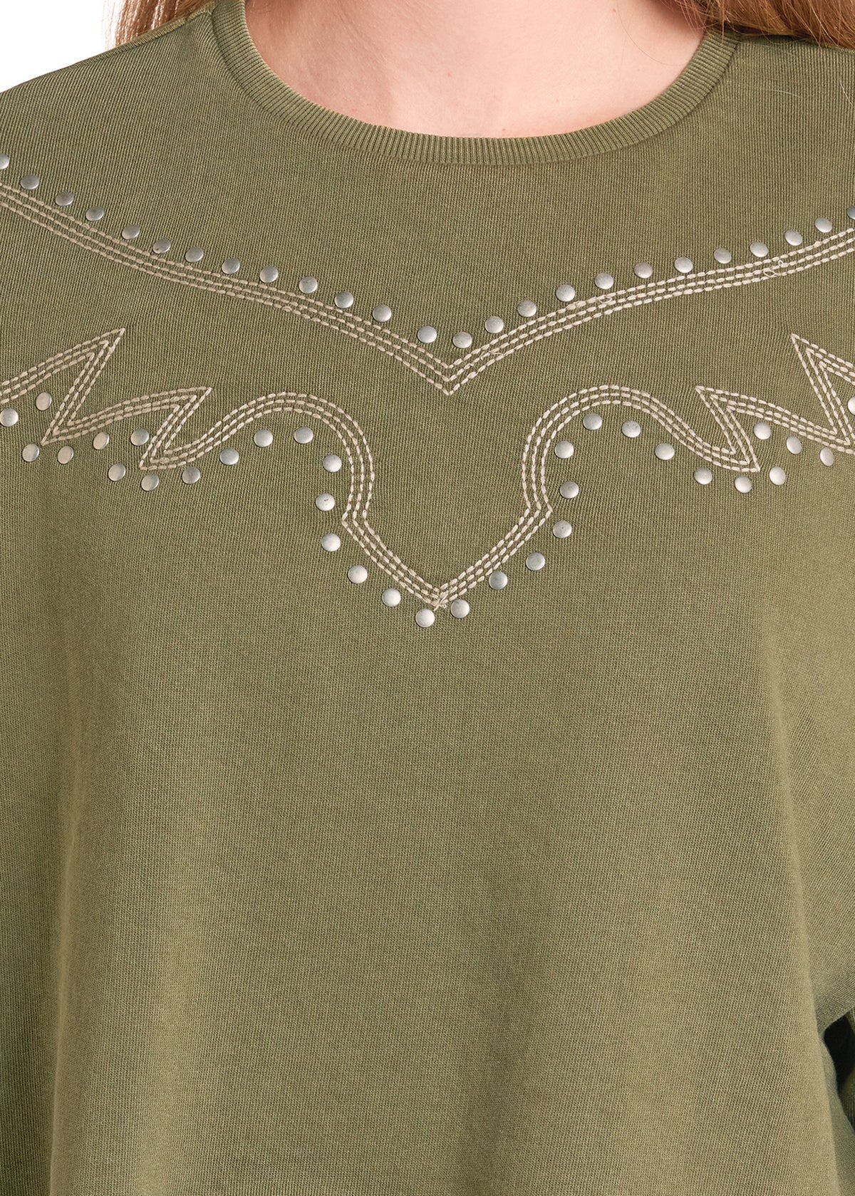 Close-up of an olive green crewneck top with western-style silver rhinestone embroidery across the chest.