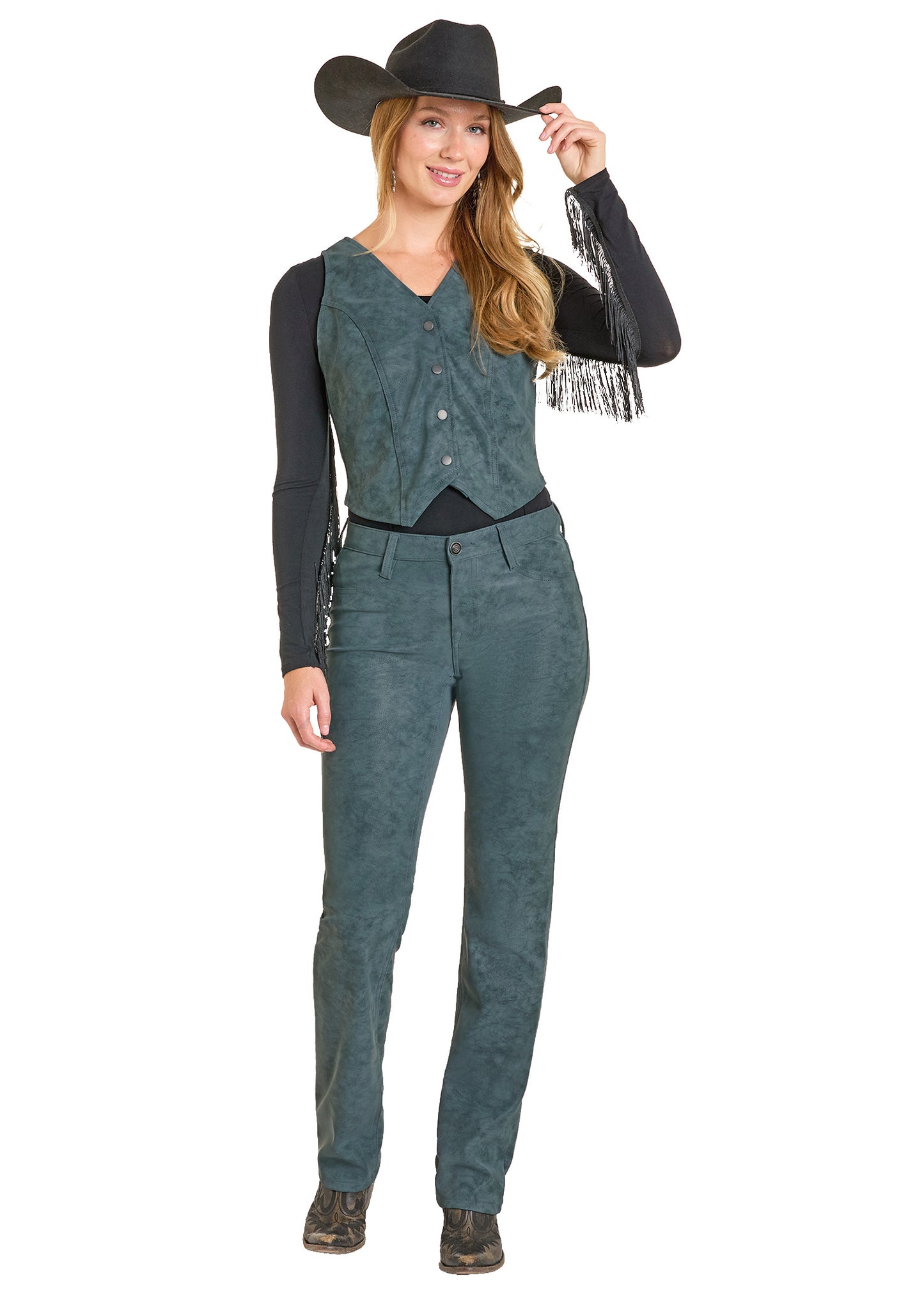 Woman wearing a cowboy outfit with a vest, pants, and hat on a white background