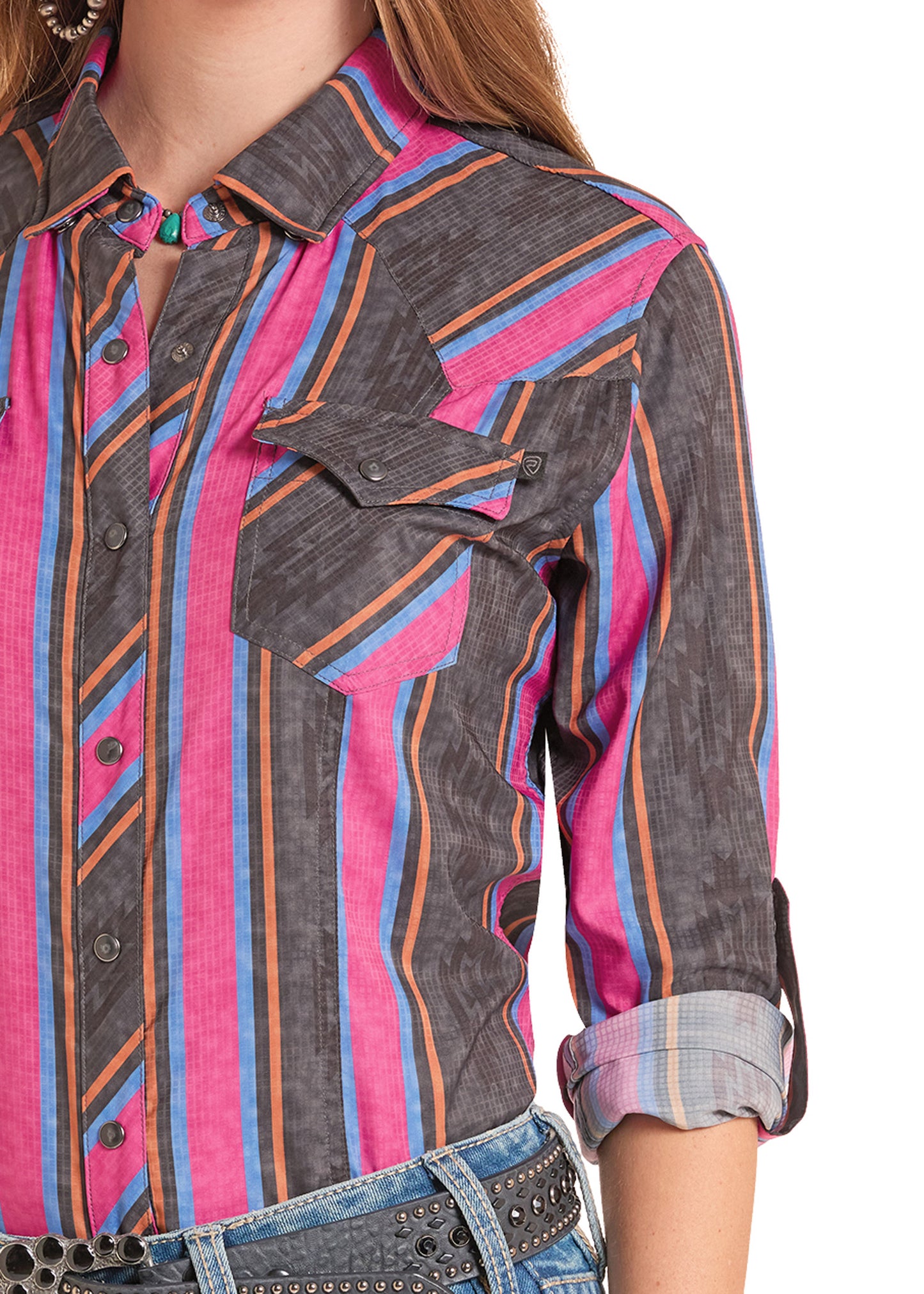 Close-up of a person wearing a colorful striped shirt with rolled-up sleeves on a white background