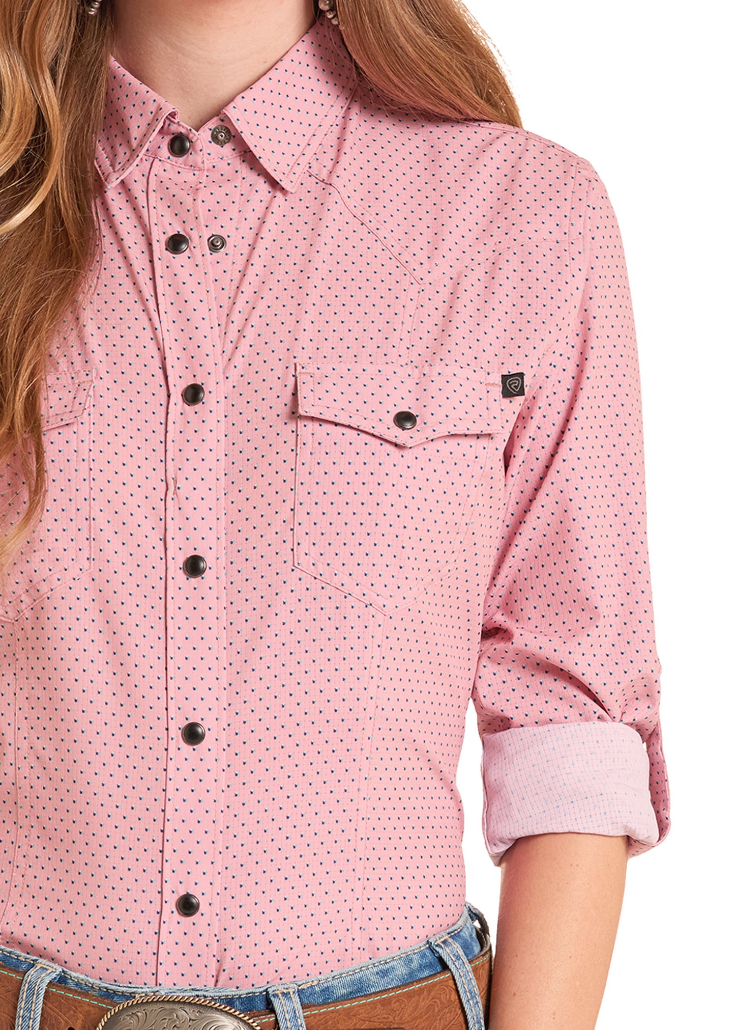Pink patterned shirt worn by a person on a white background