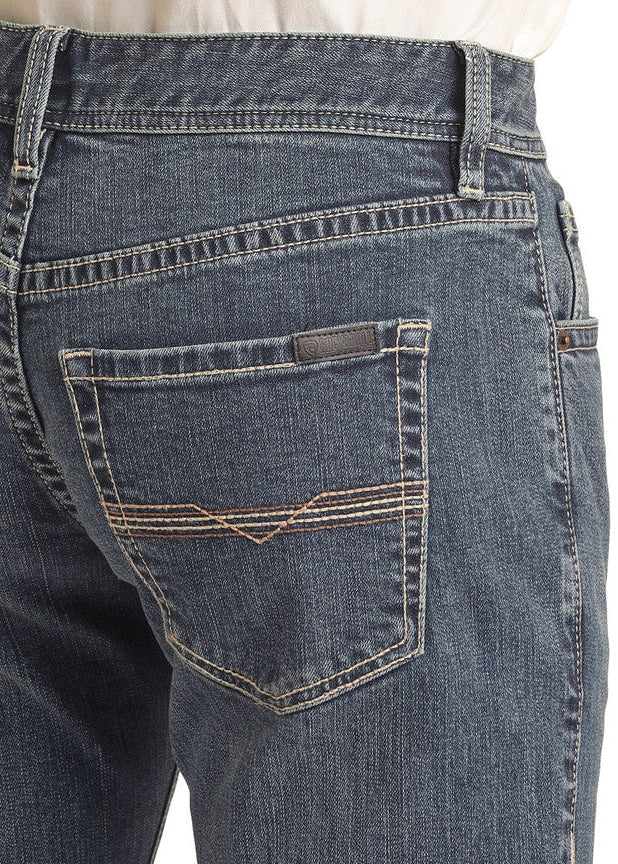 A person is shown from the waist down wearing Rock & Roll Denim's Vintage '46 Slim Fit Ivory Stitch Straight Leg Jeans with a tucked-in white shirt, highlighting the back pockets of the jeans.