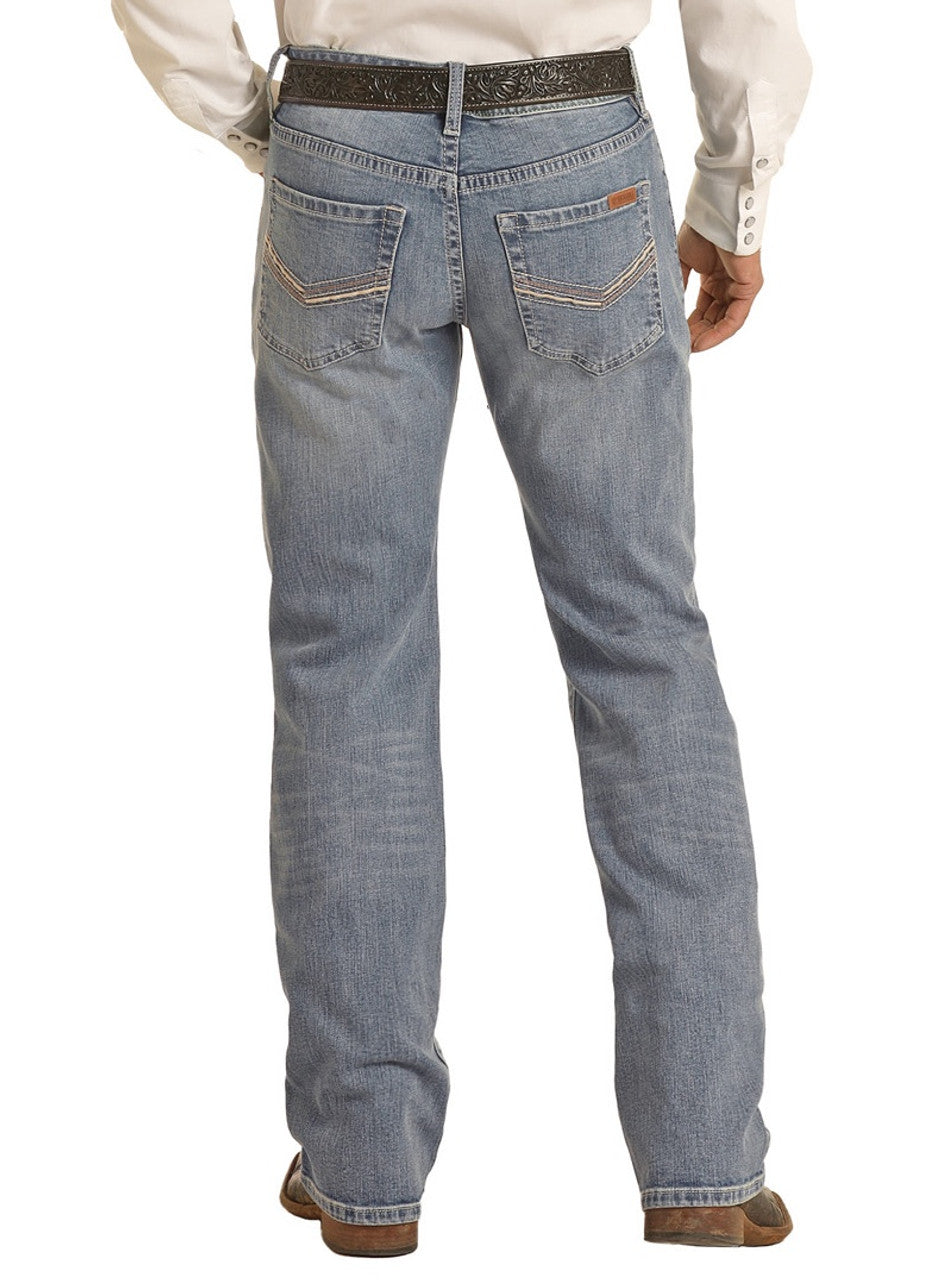 Someone is shown from the back wearing Rock & Roll Denim Vintage '46 Regular Fit V Embroidered Stackable Bootcut Jeans in light blue, paired with a white button-down shirt, black belt, and brown shoes against a white background.