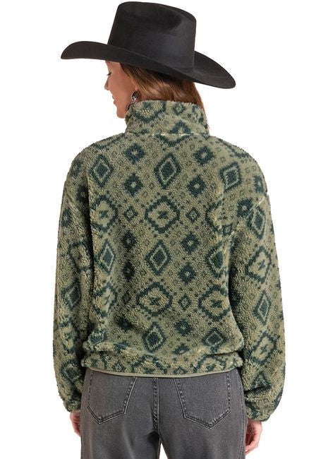 A model shown from the back wearing a green and dark green patterned quarter-zip fleece jacket, dark gray jeans, and a black cowboy hat against a plain white background.