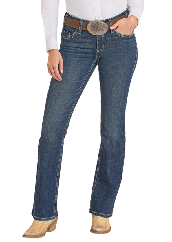 Woman wearing a white shirt, blue jeans, and a beige cowboy hat on a white background