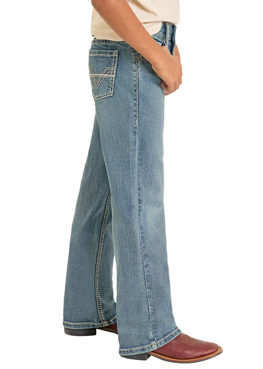 Child wearing a cowboy hat, graphic t-shirt, and jeans on a white background