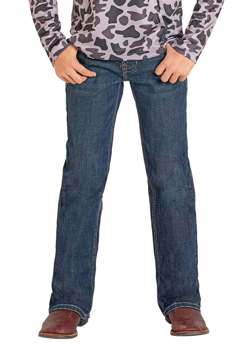 Child wearing a camouflage shirt, jeans, and a cowboy hat on a white background
