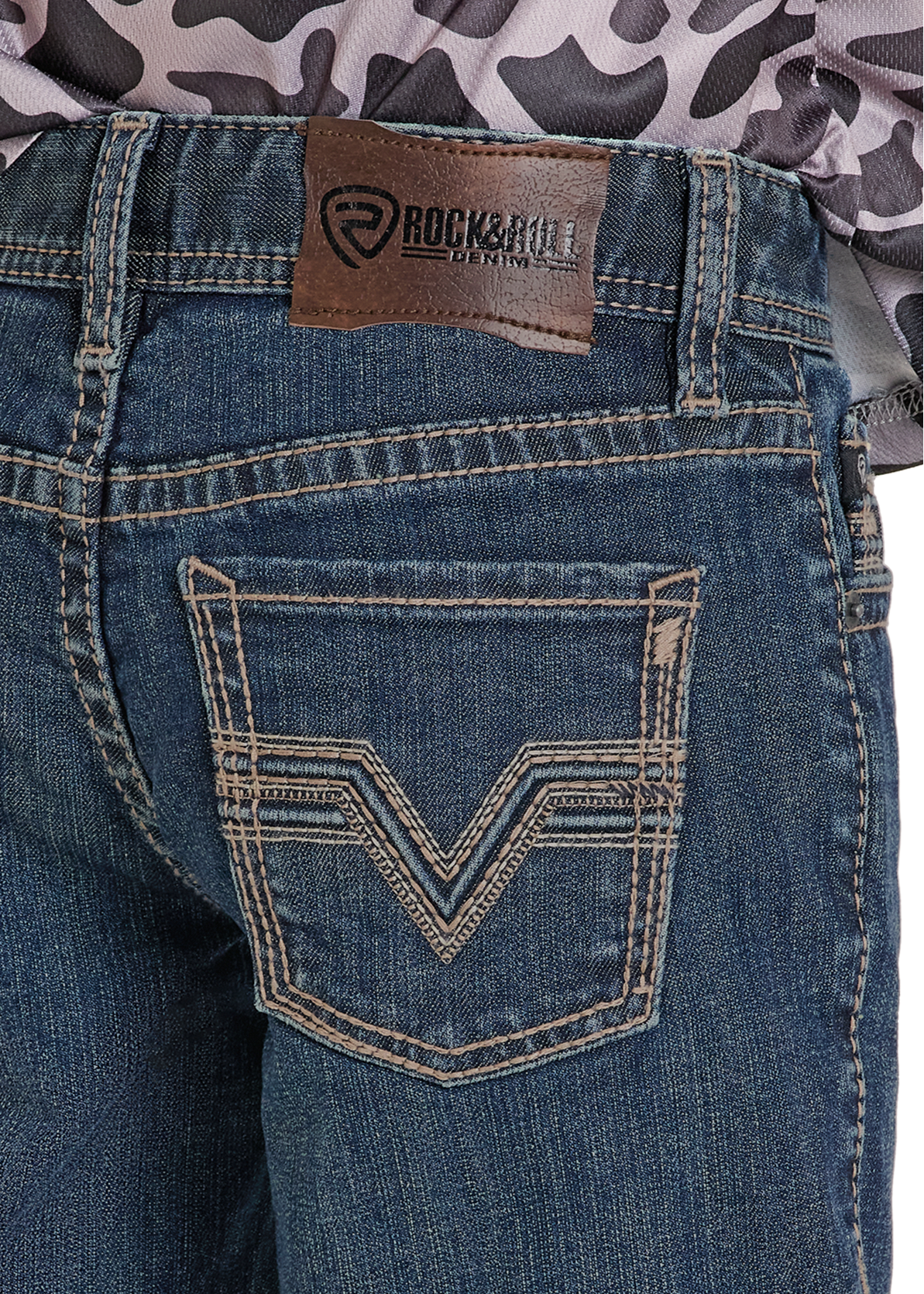 Close-up of blue jeans with a brand label on a white background
