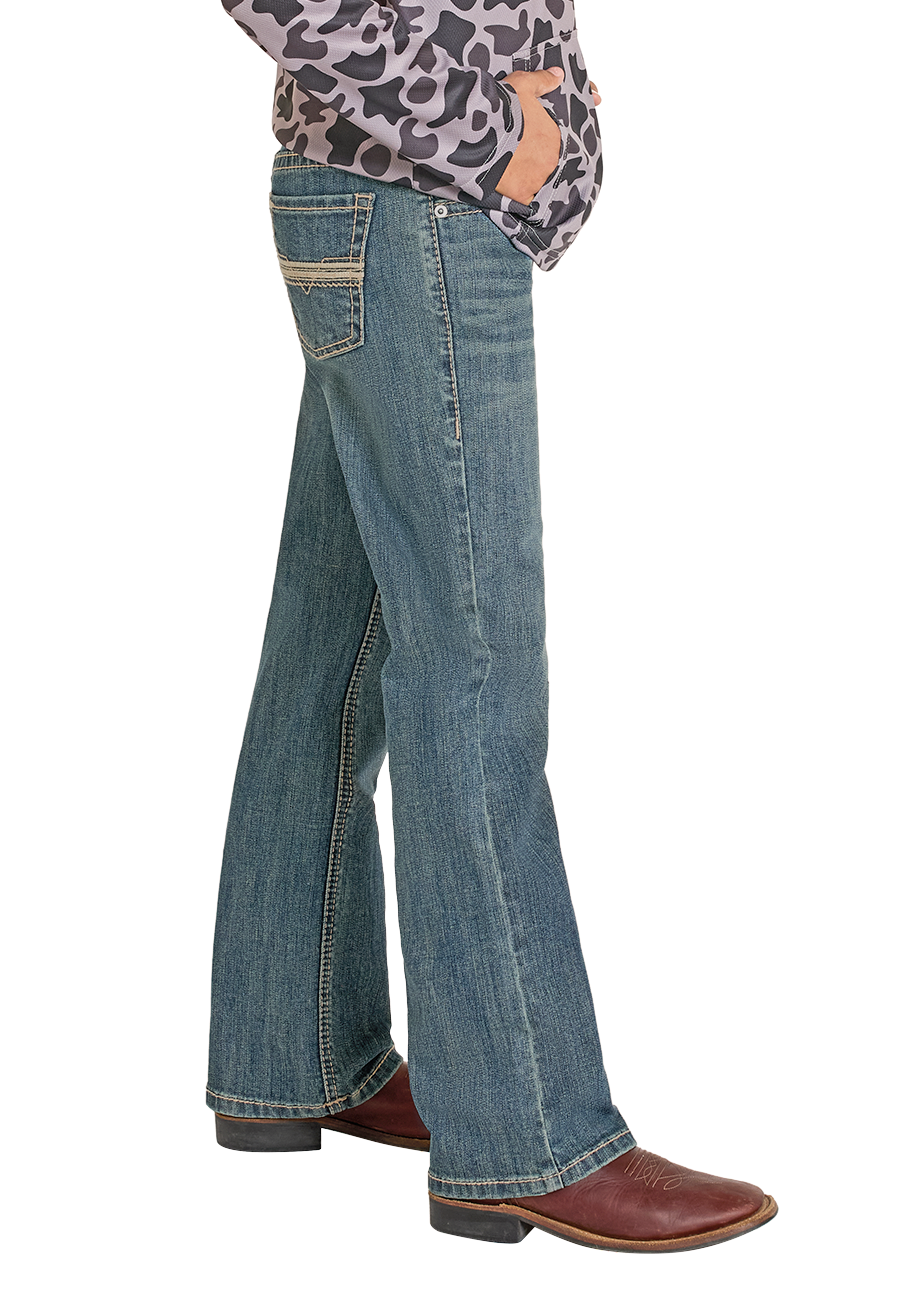 Child wearing a leopard print shirt, blue jeans, and a black cowboy hat on a white background